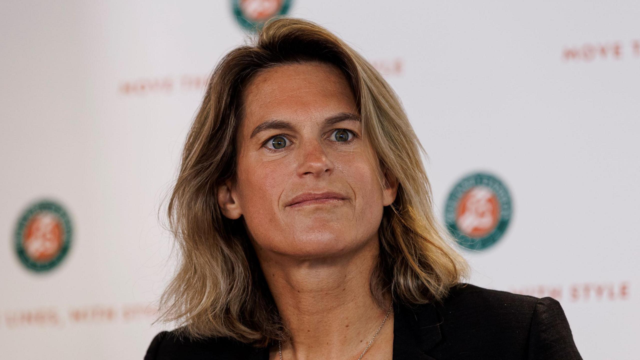 Amelie Mauresmo listens to a question during her French Open news conference