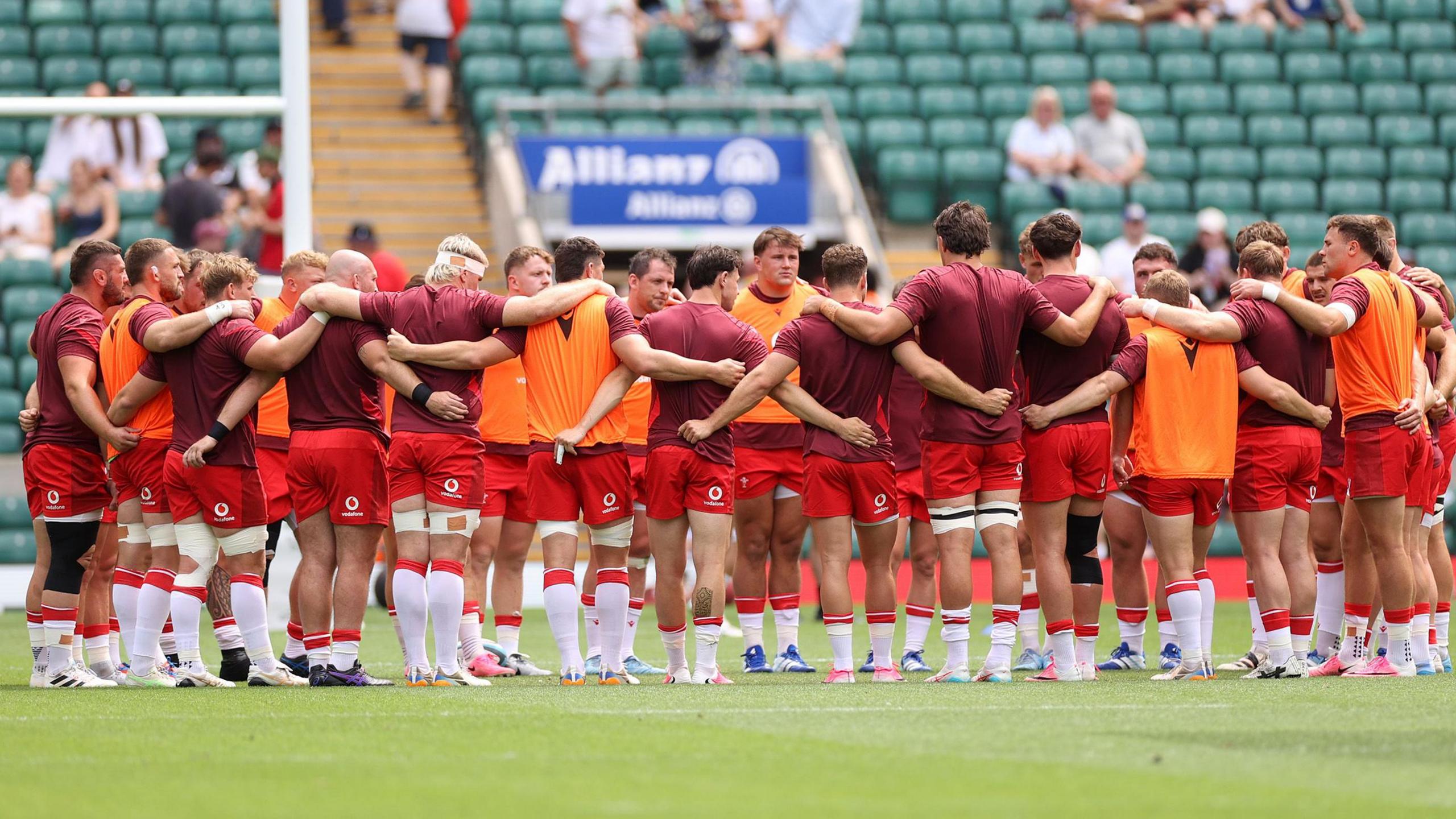 Wales players in a huddle before the game against the Barbarians