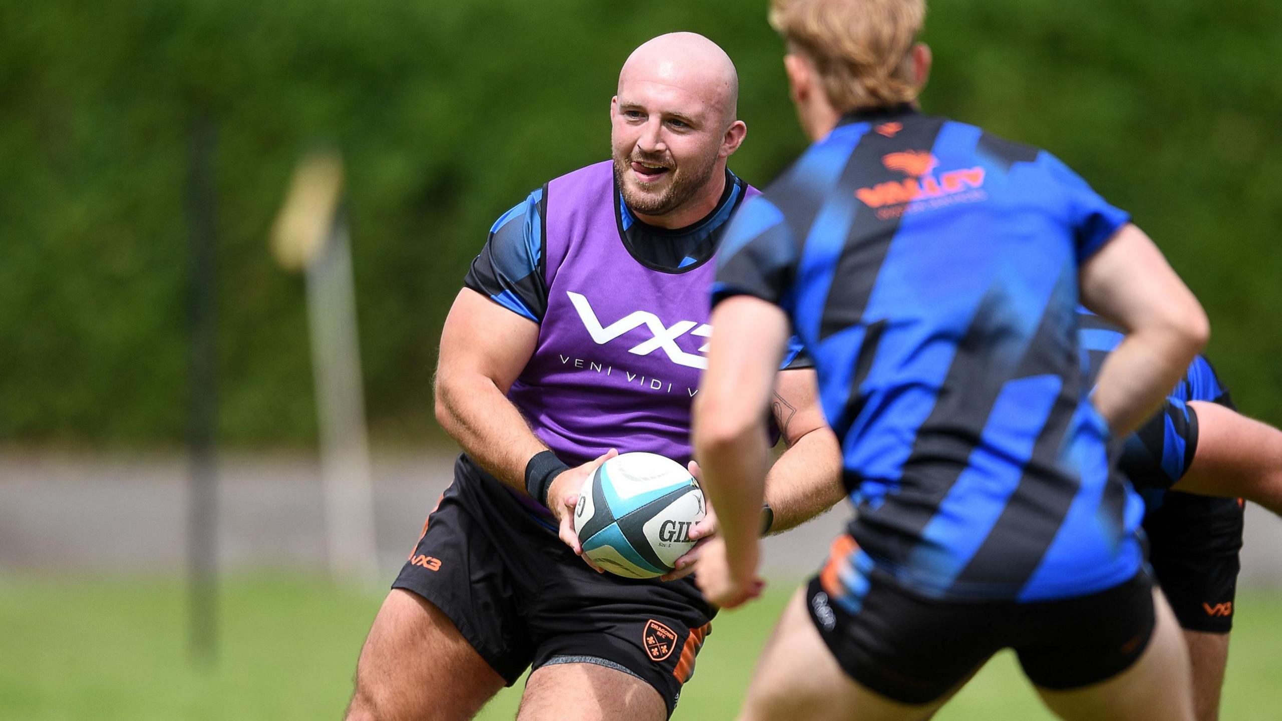 Prop Dillon Lewis runs with the ball for the Dragons in training
