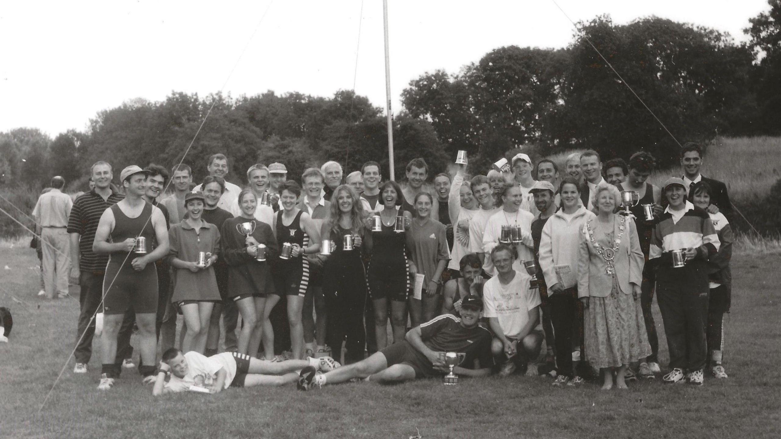 Members of Sudbury Rowing Club celebrating the Easter opening on the meadow