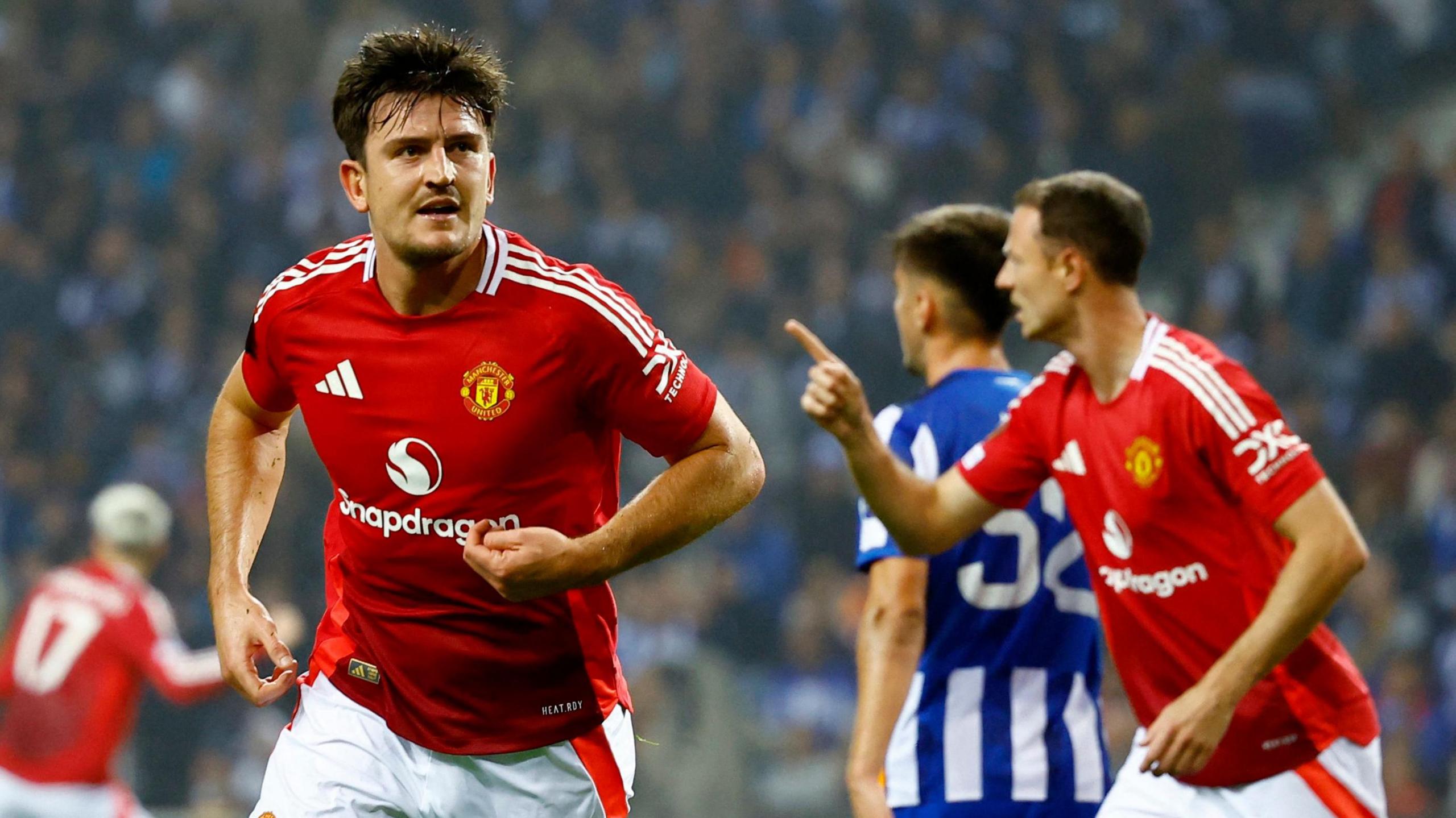 Harry Maguire celebrates his equalising goal for Manchester United at Porto