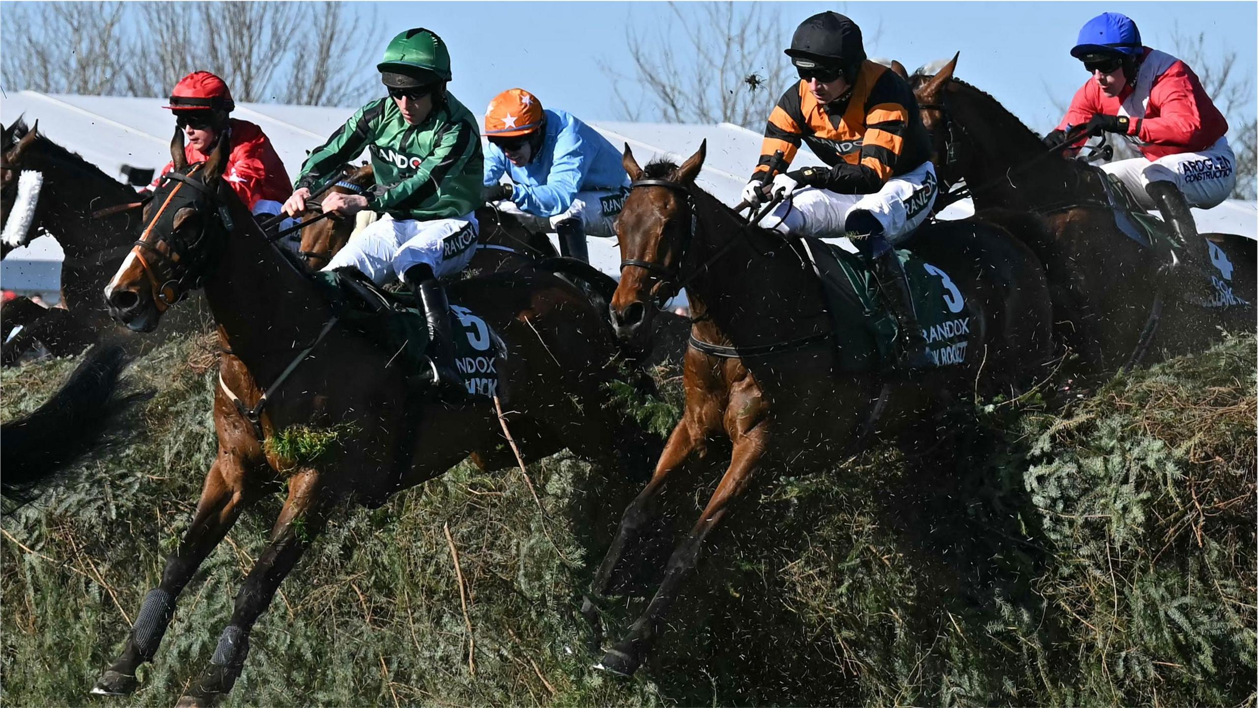 Jockey Patrick Mullins (2R) jumps The Chair on Nick Rockett on the first circuit on the way to winning the Grand National Handicap Chase on the final day of the Grand National Festival horse race meeting at Aintree Racecourse in Liverpool,