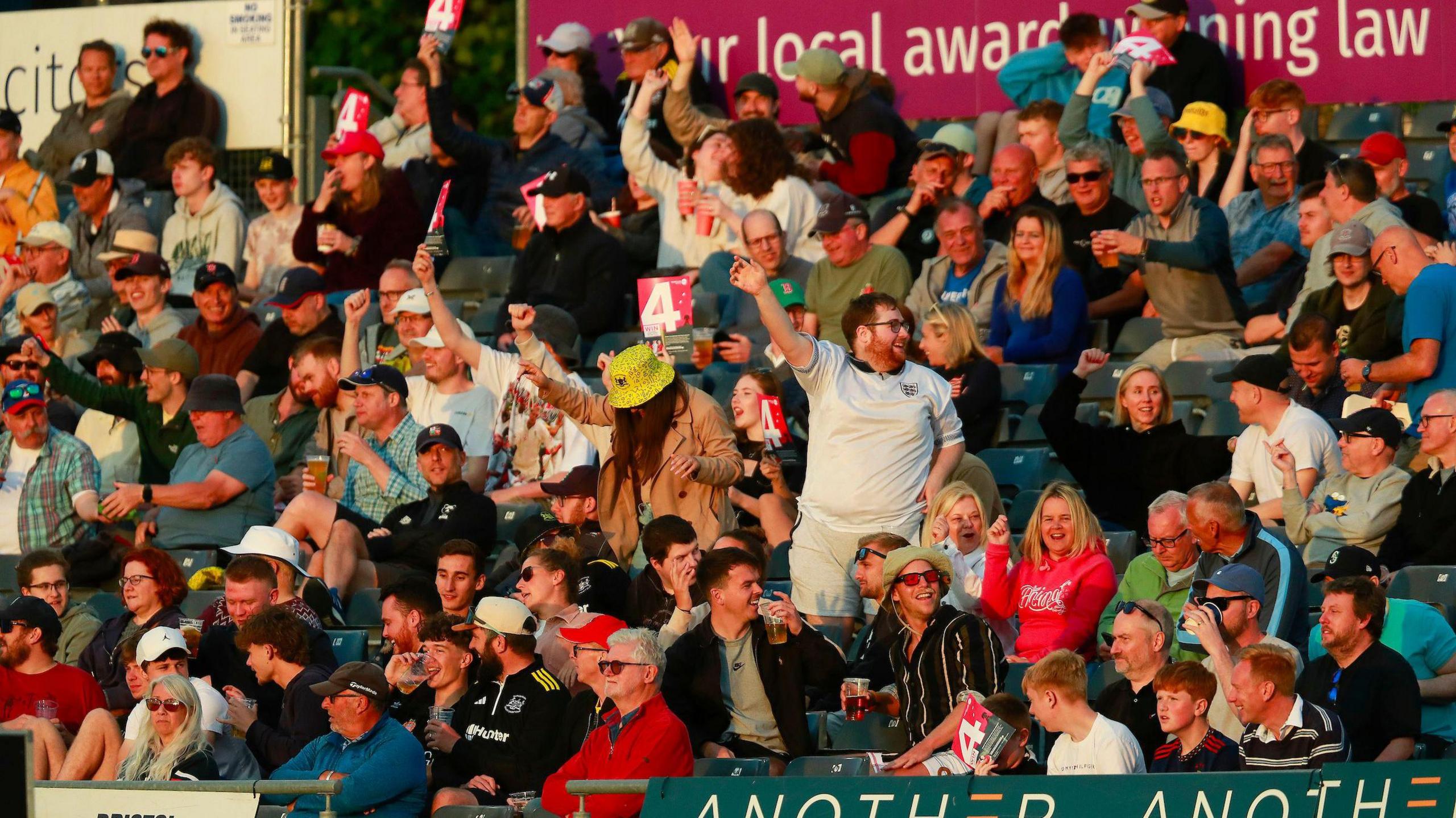 Gloucestershire cricket fans cheer on their team from the stands during the T20 match with Kent at the County Ground in Bristol