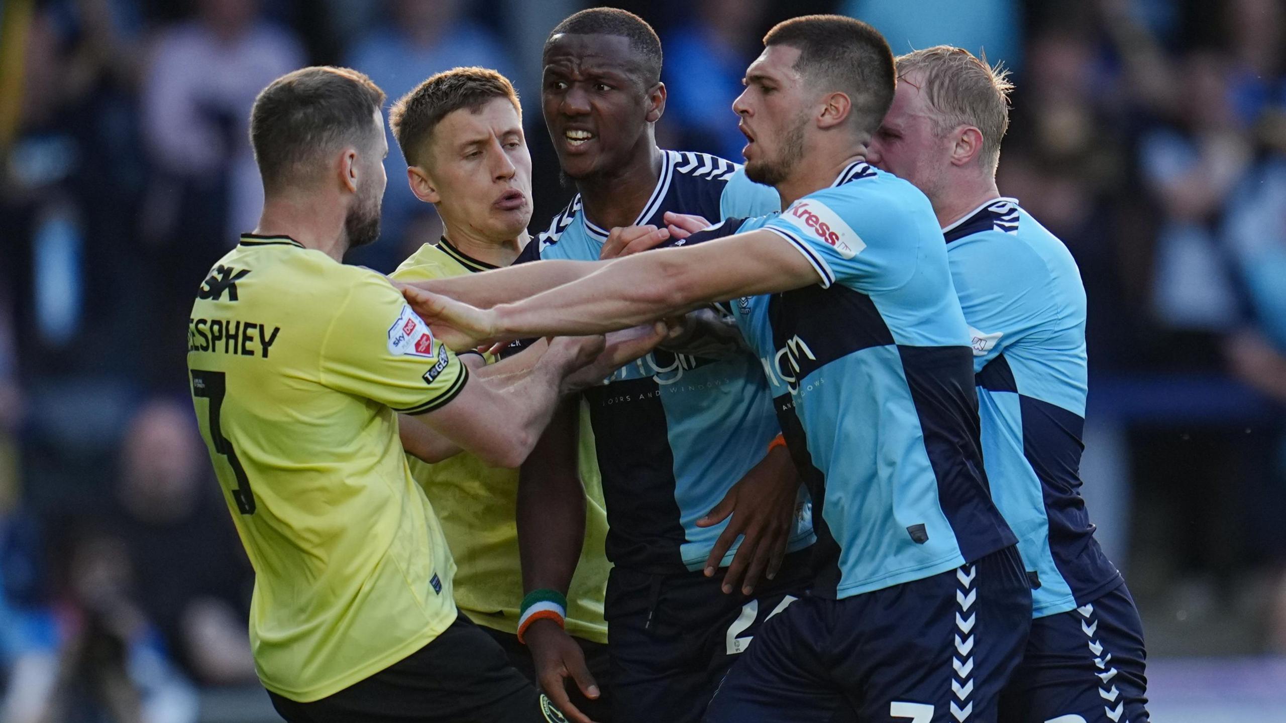Charlton and Wycombe players in confrontation