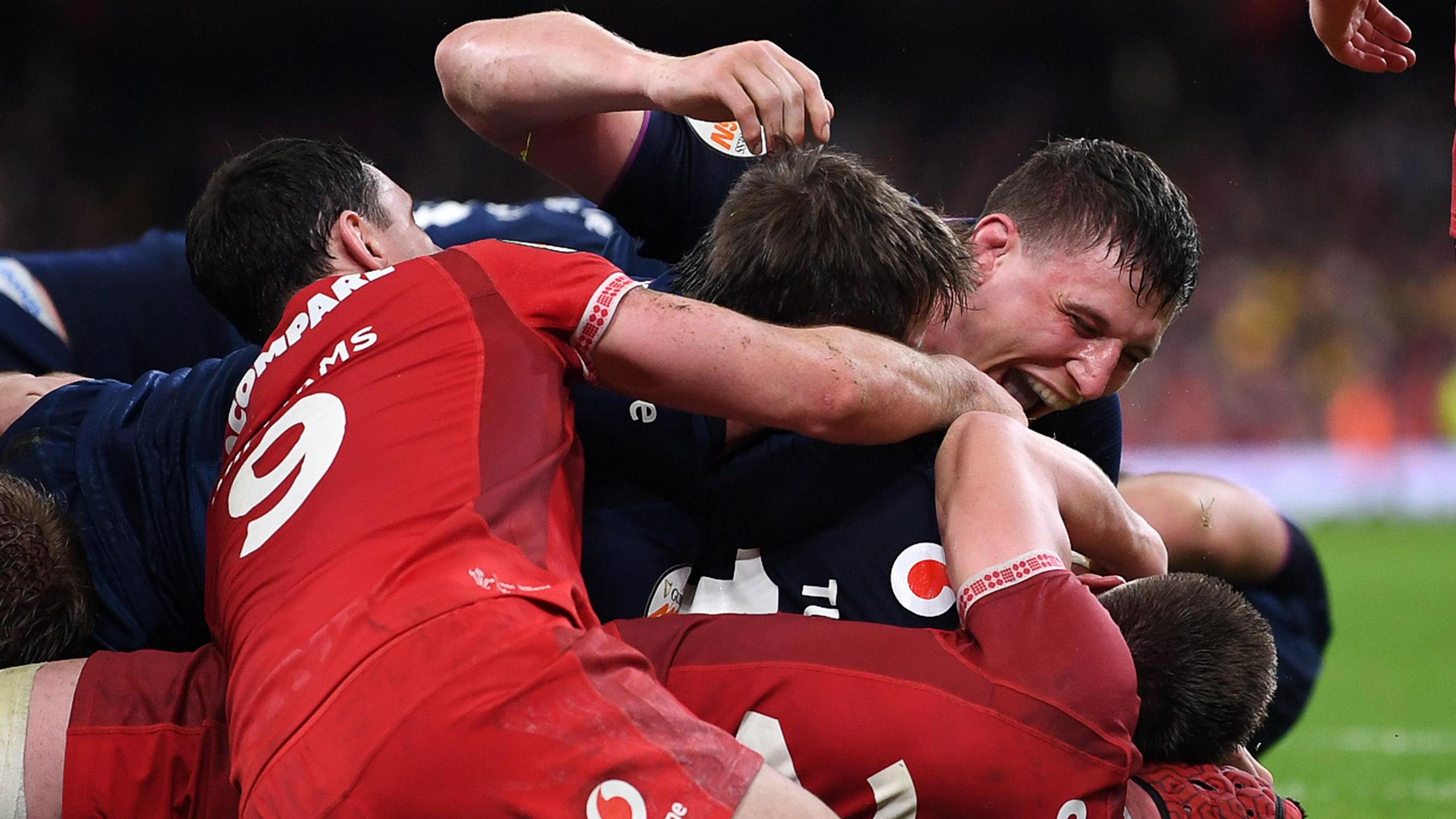 Scotland players celebrate after replacement hooker George Turner scores the bonus-point try against Wales