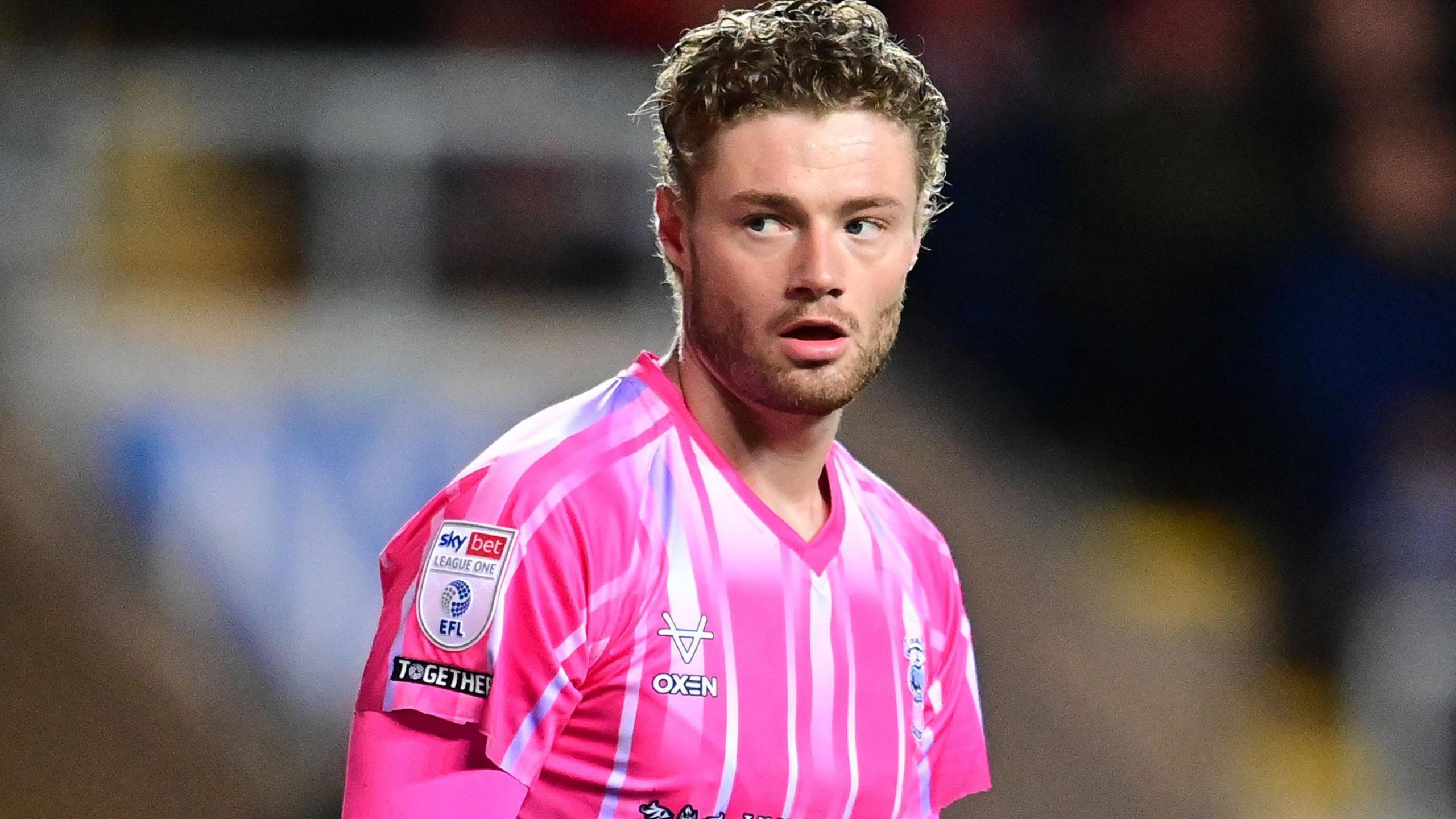 Lukas Jensen on the field during a match for Lincoln