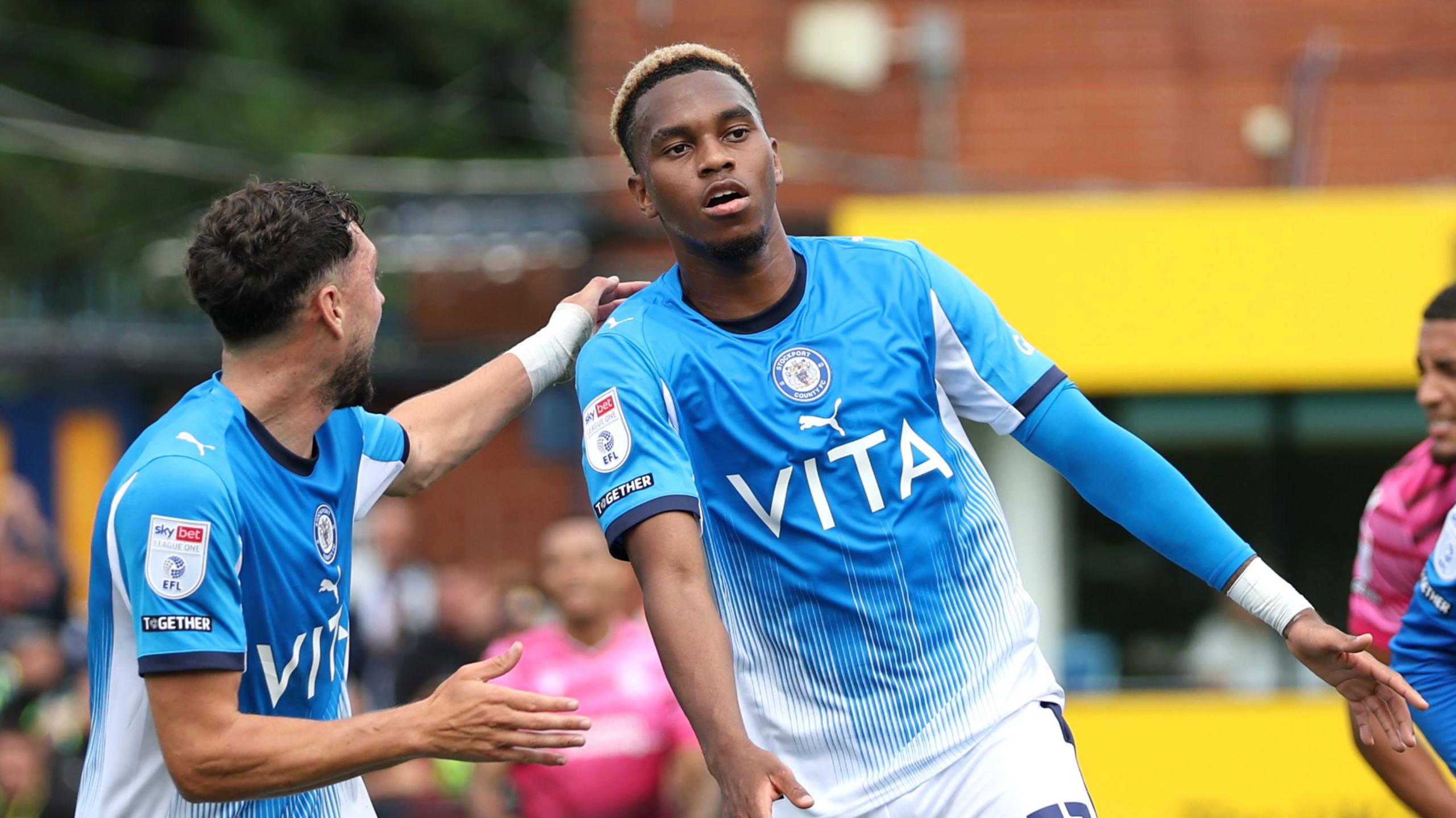 Malik Mothersille celebrates his goal for Stockport County against Bolton Wanderers.