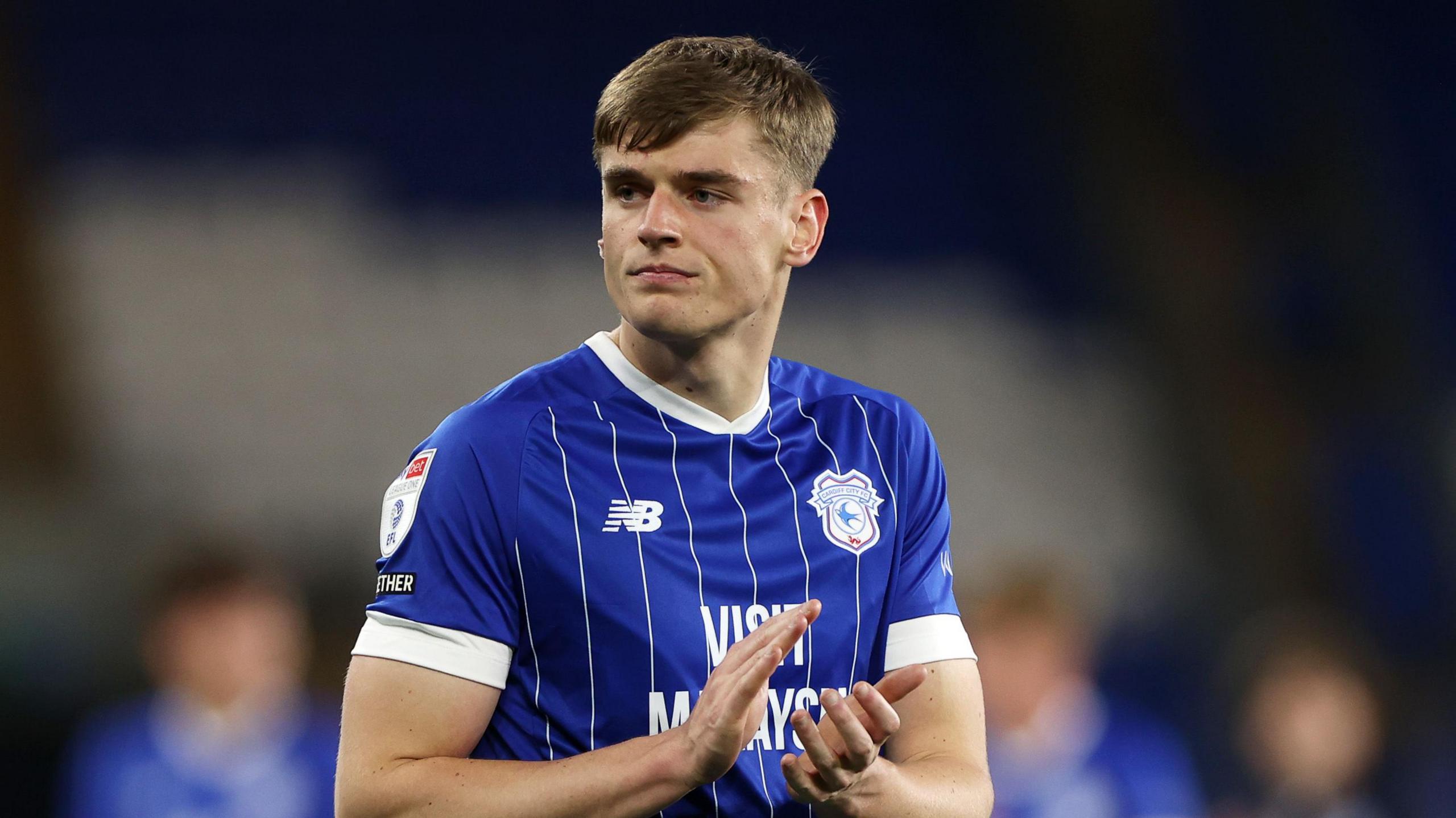 Dylan Lawlor applauds after a Cardiff game 