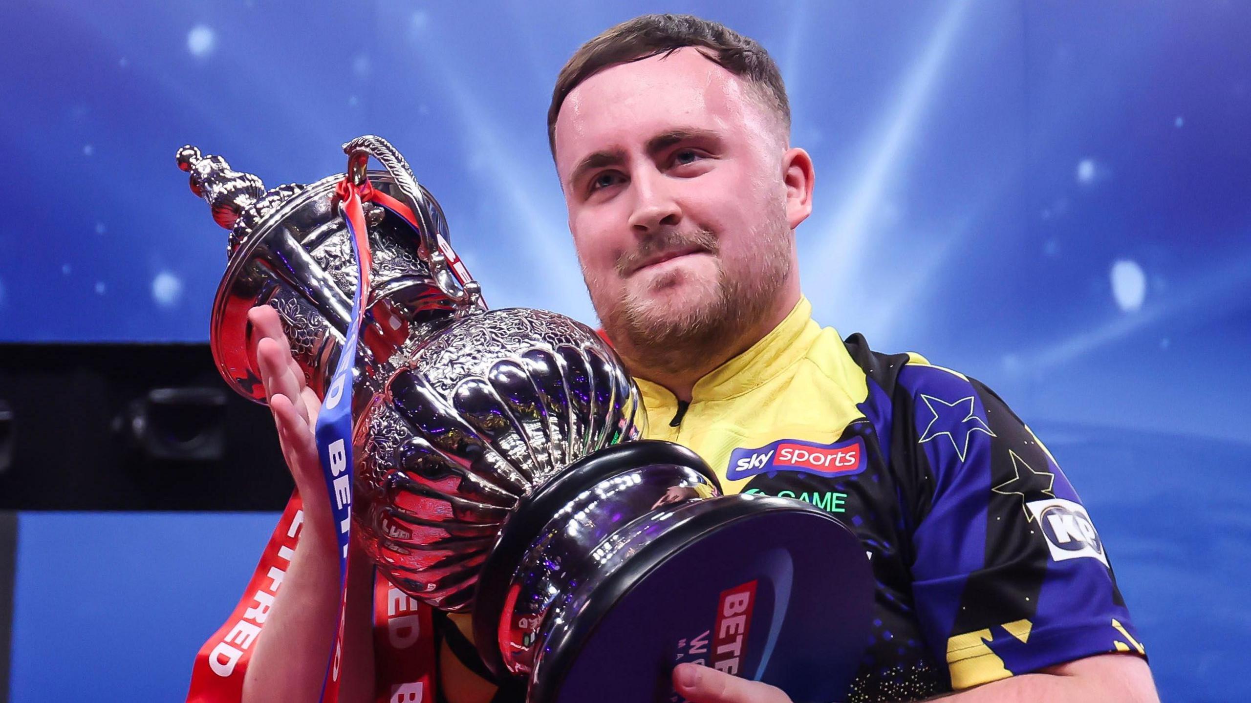 Luke Littler with World Matchplay trophy after his victory in 2026