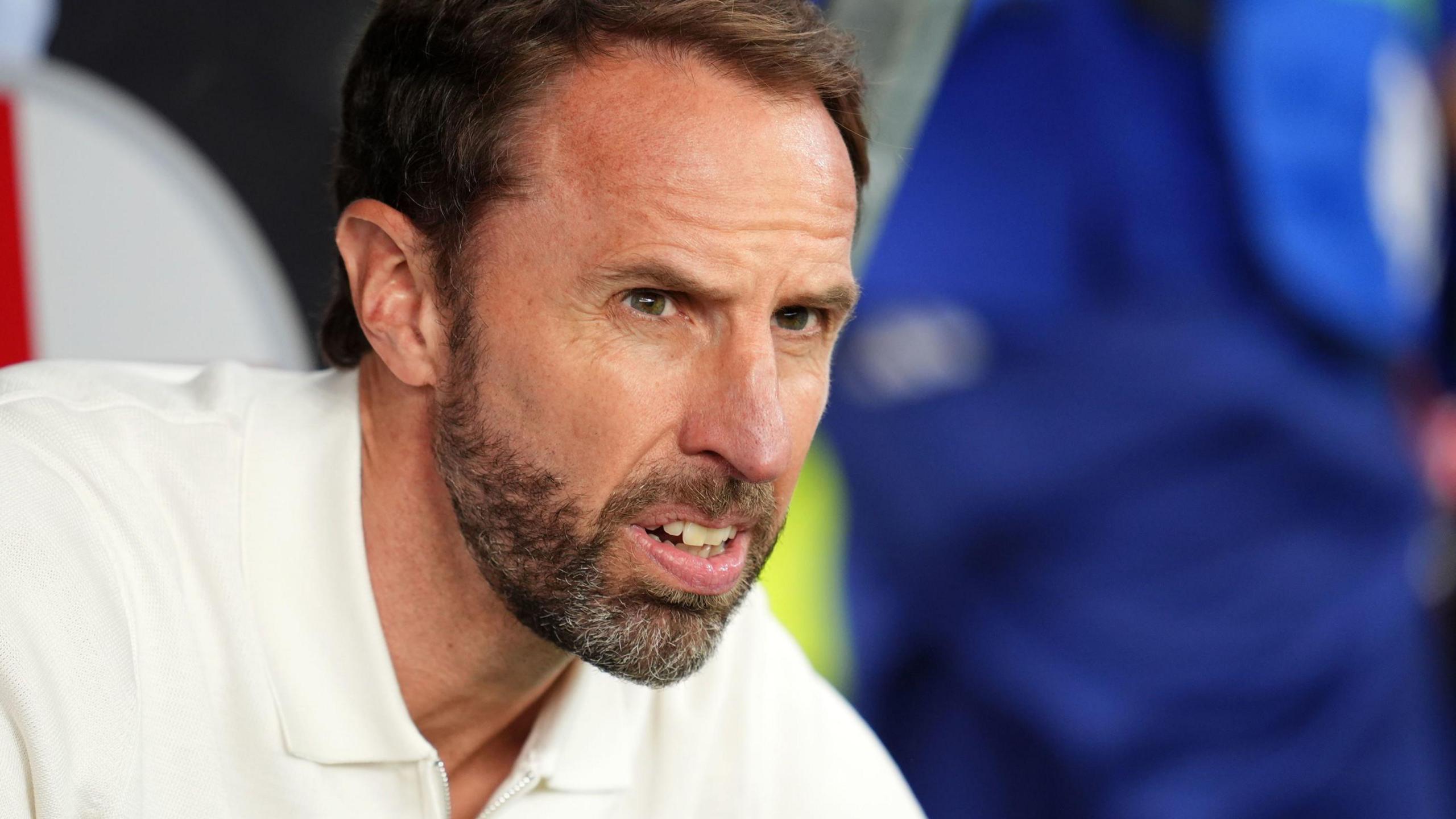 Gareth Southgate sits in the dugout