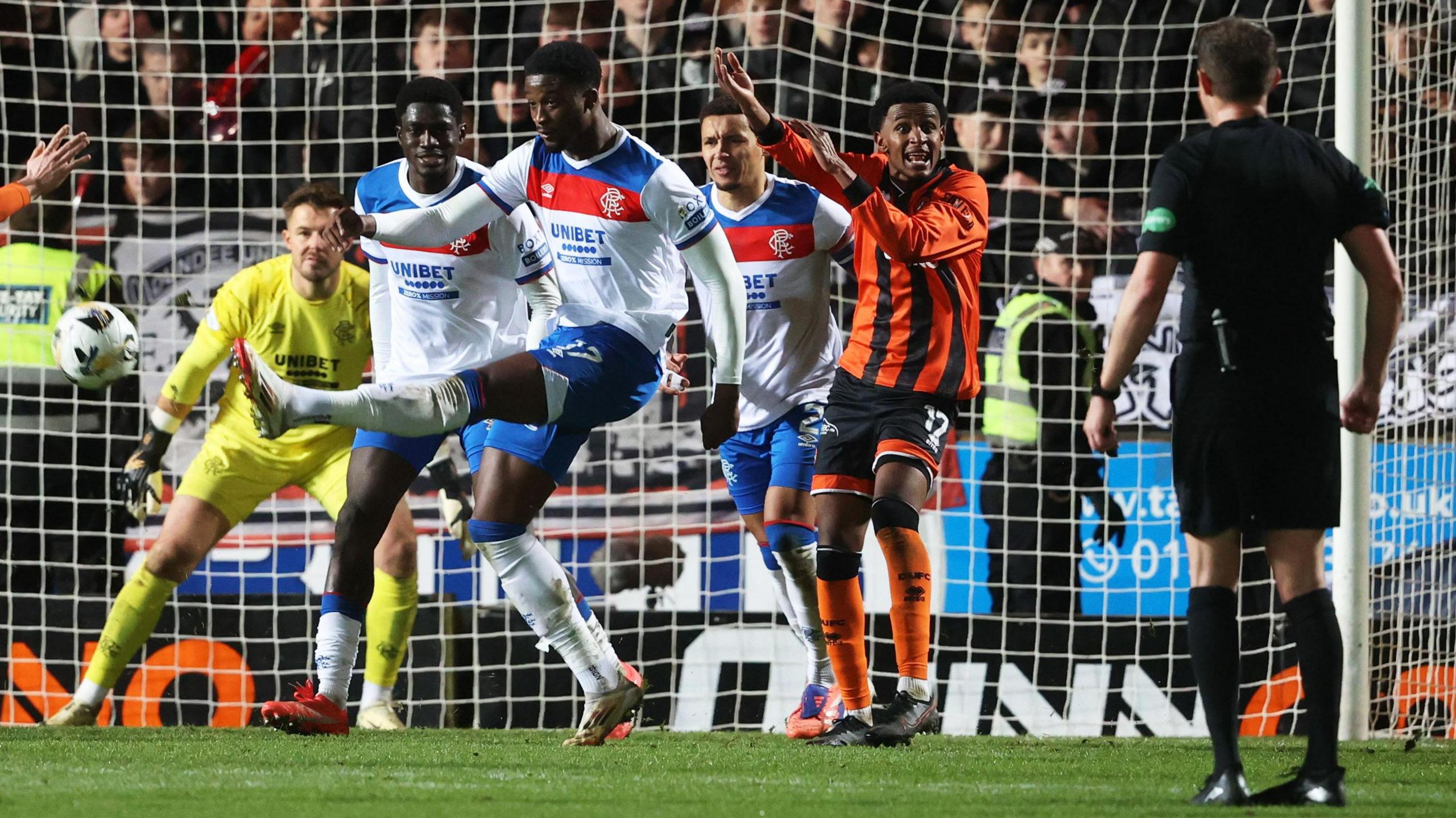 Amar Fatah appeals for a penalty after the ball strikes Emmanuel Fernandez's hand