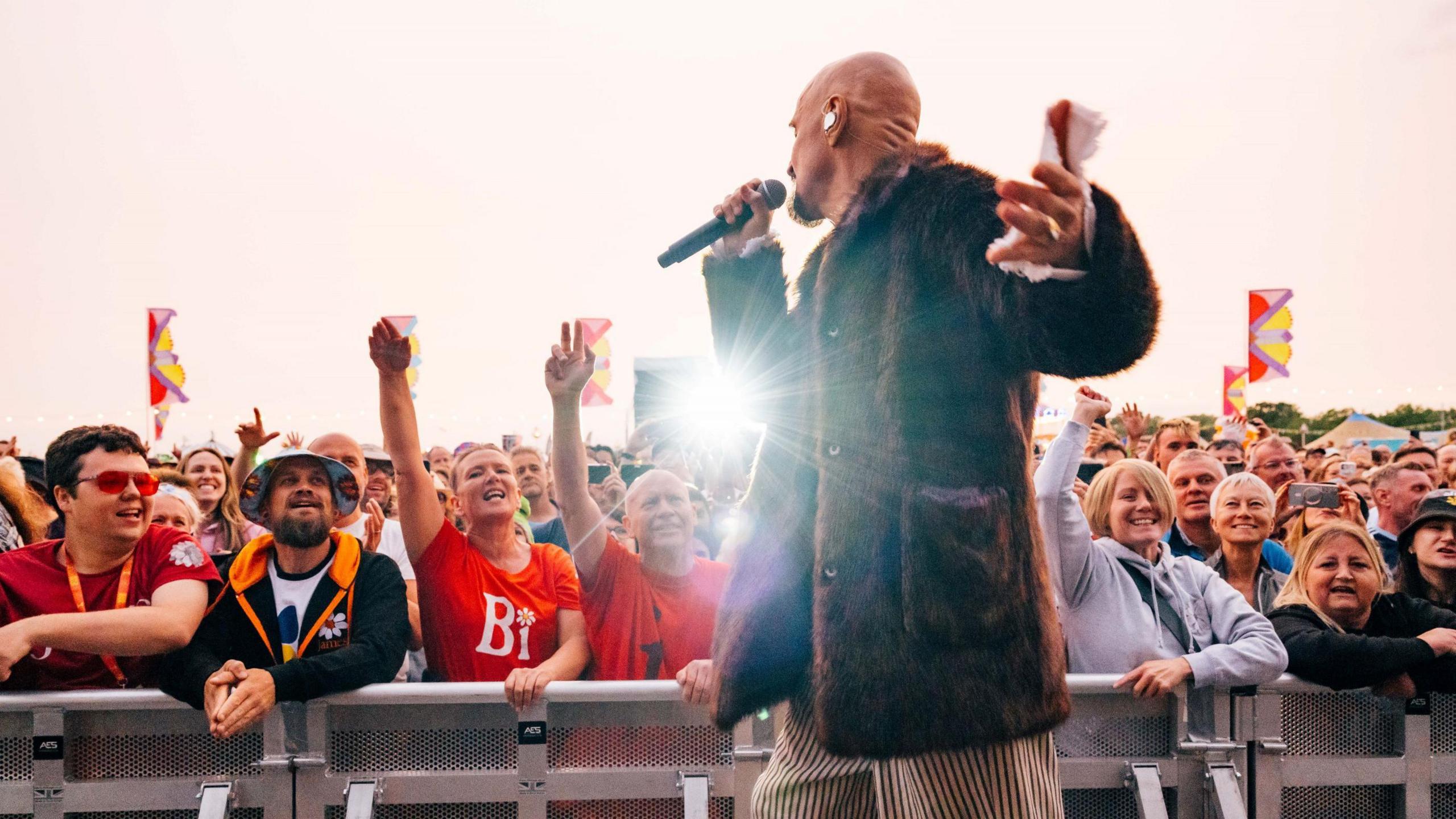 Tim Booth from the band James gets close to the front row of the crowd as he performs at the Wychwood Festival at Cheltenham Racecourse