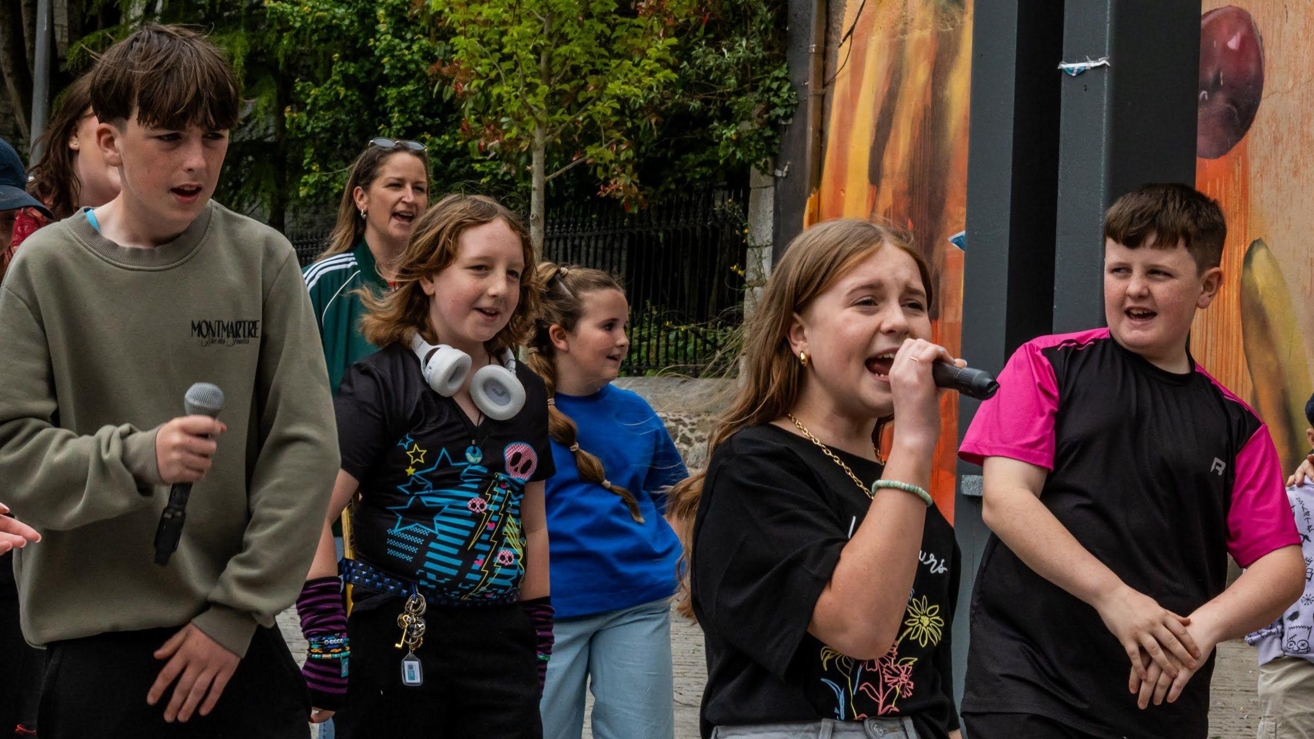 A group of children singing. 