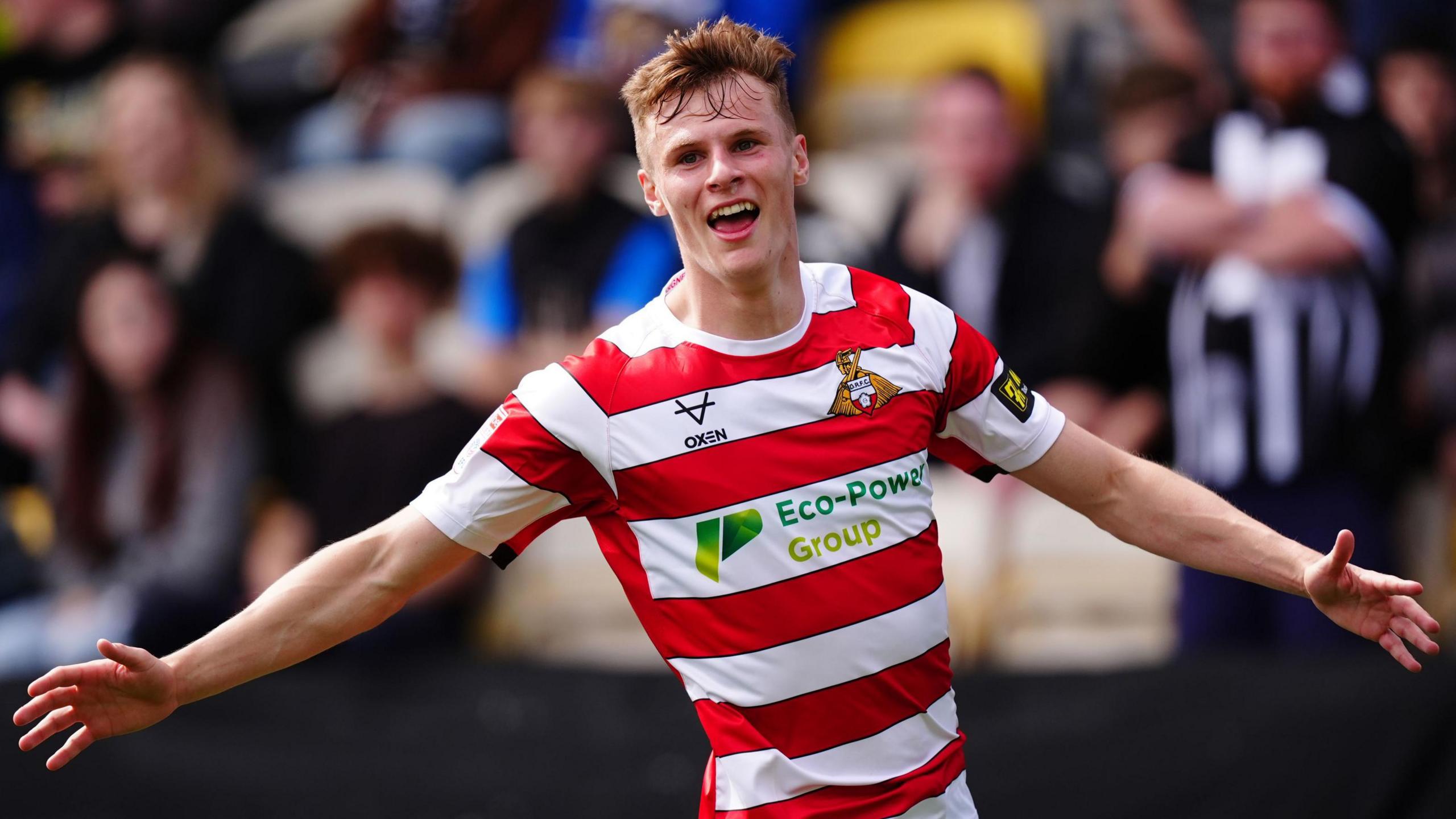 Robert Street celebrates after scoring for Doncaster against Notts County