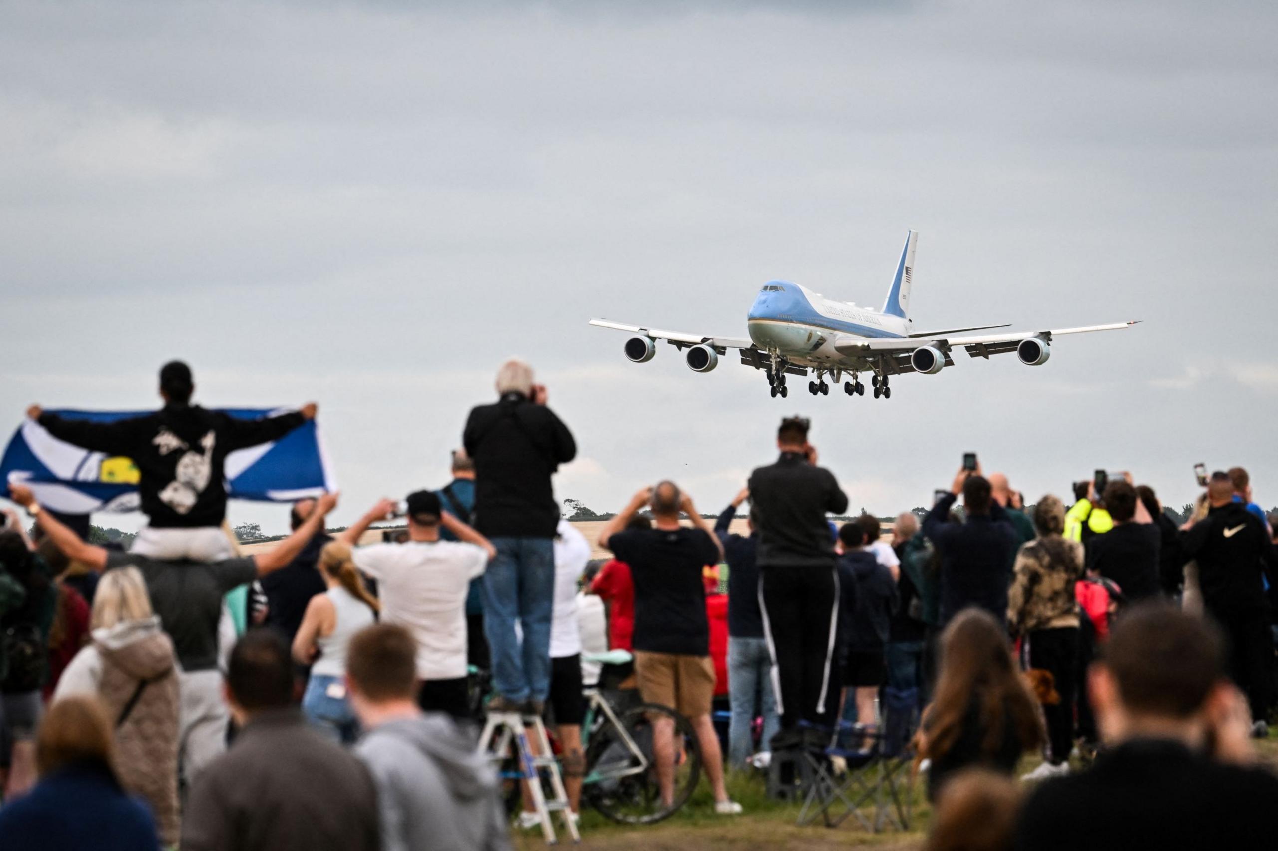 Crowds watch as Air Force One approaches Prestwick