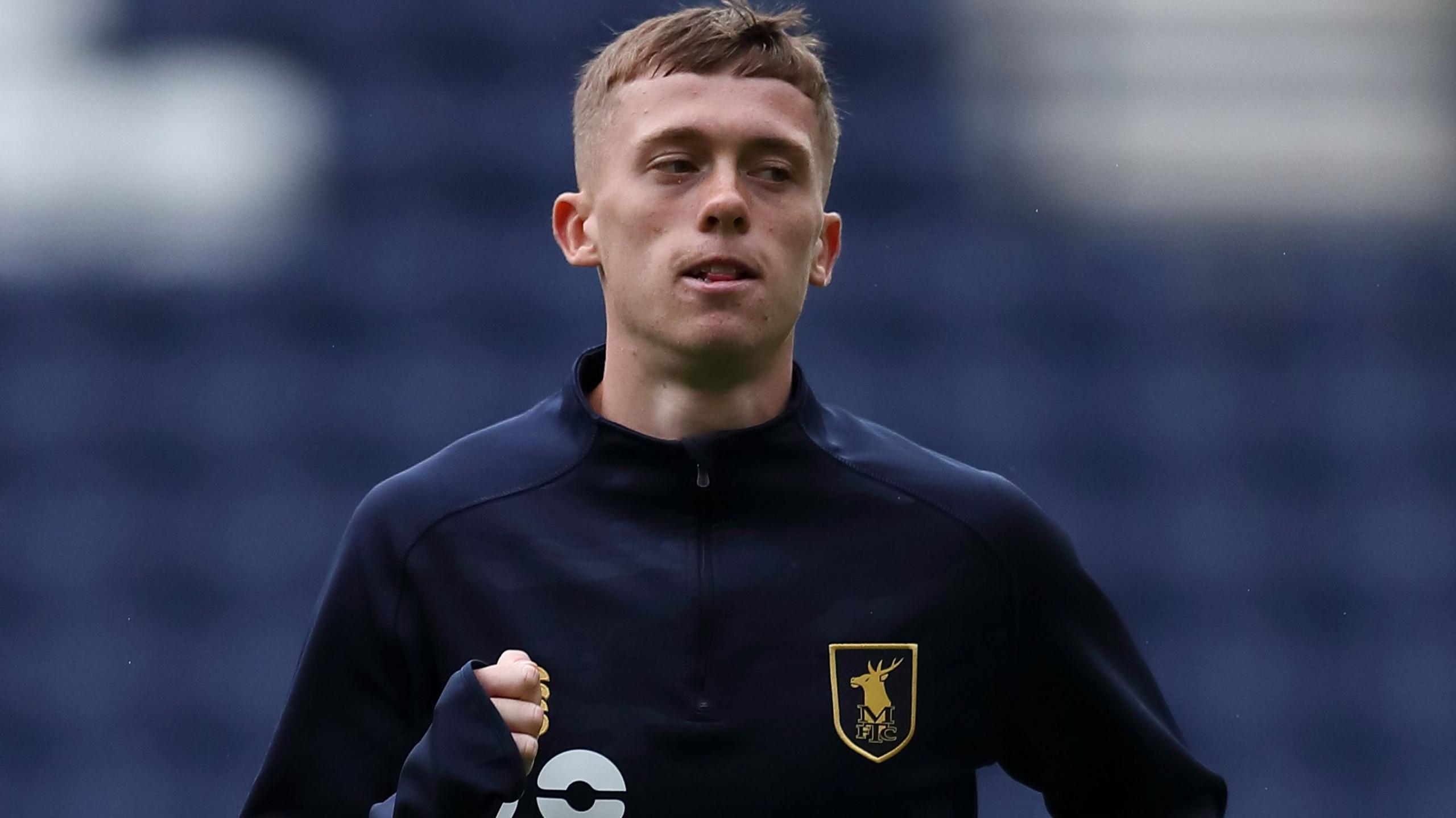 Striker Jimmy Knowles warming up for Mansfield