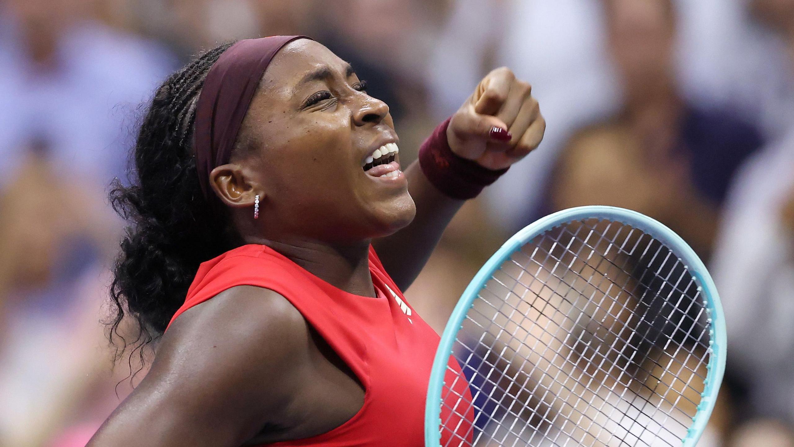 Coco Gauff punches the air during her 2025 US Open match