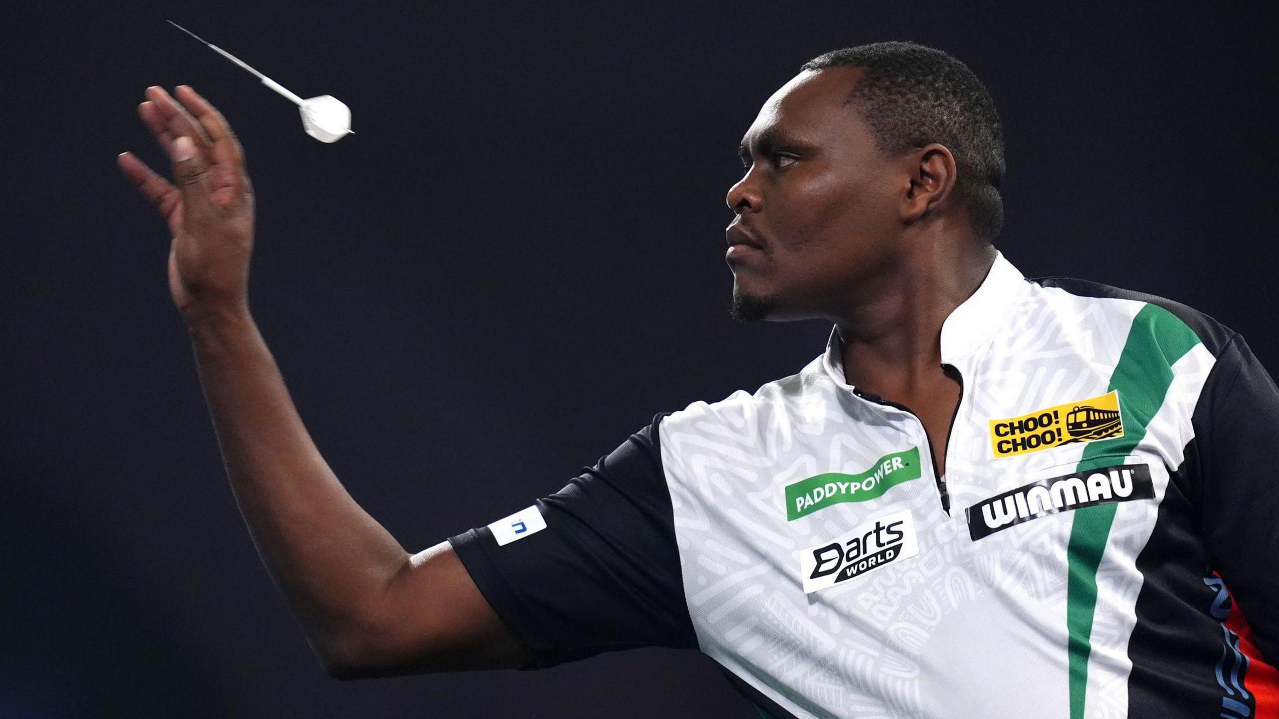 David Munyua throws a dart