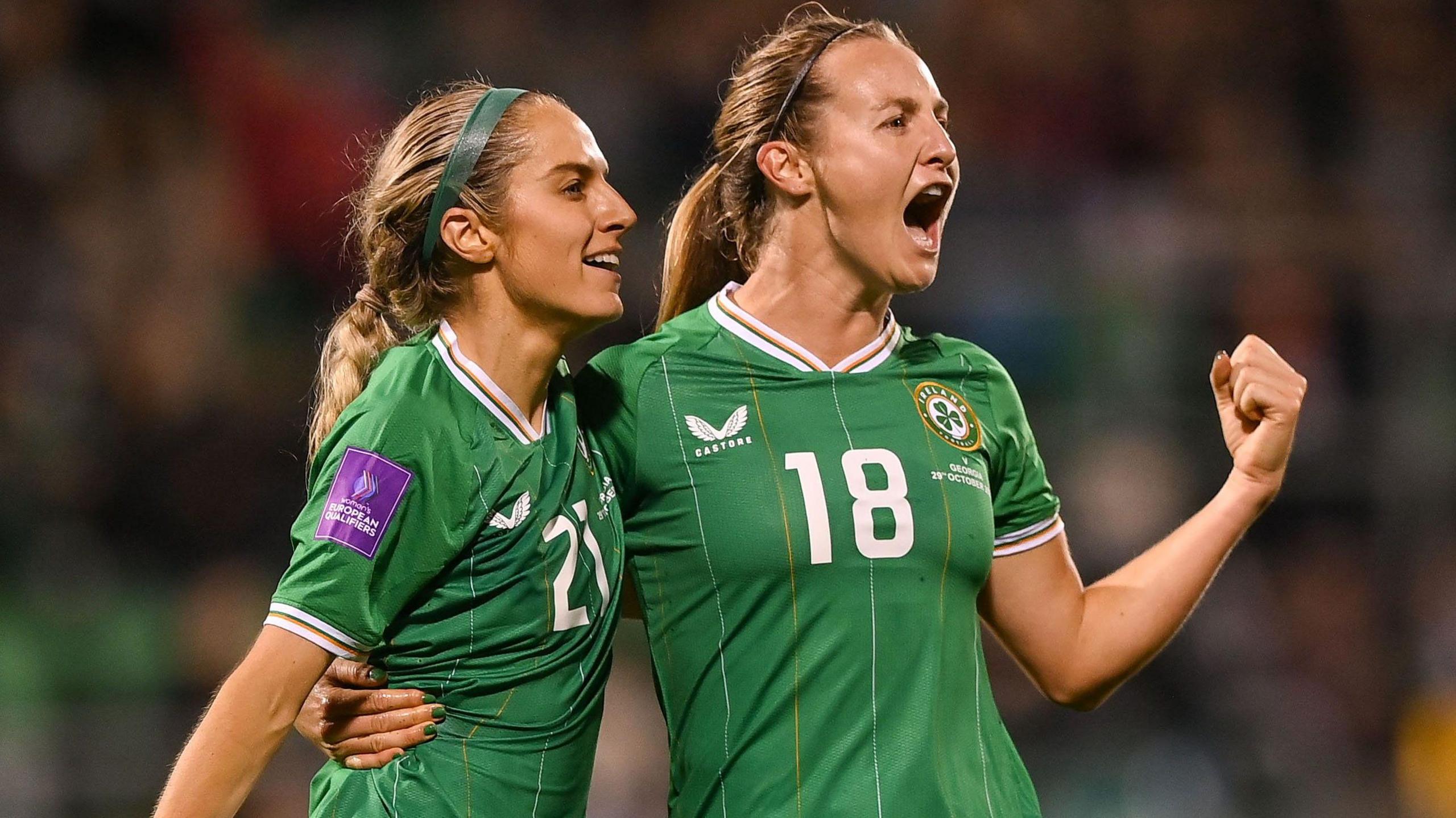 Kyra Carusa and Julie-Ann Russell celebrating Carusa's goal