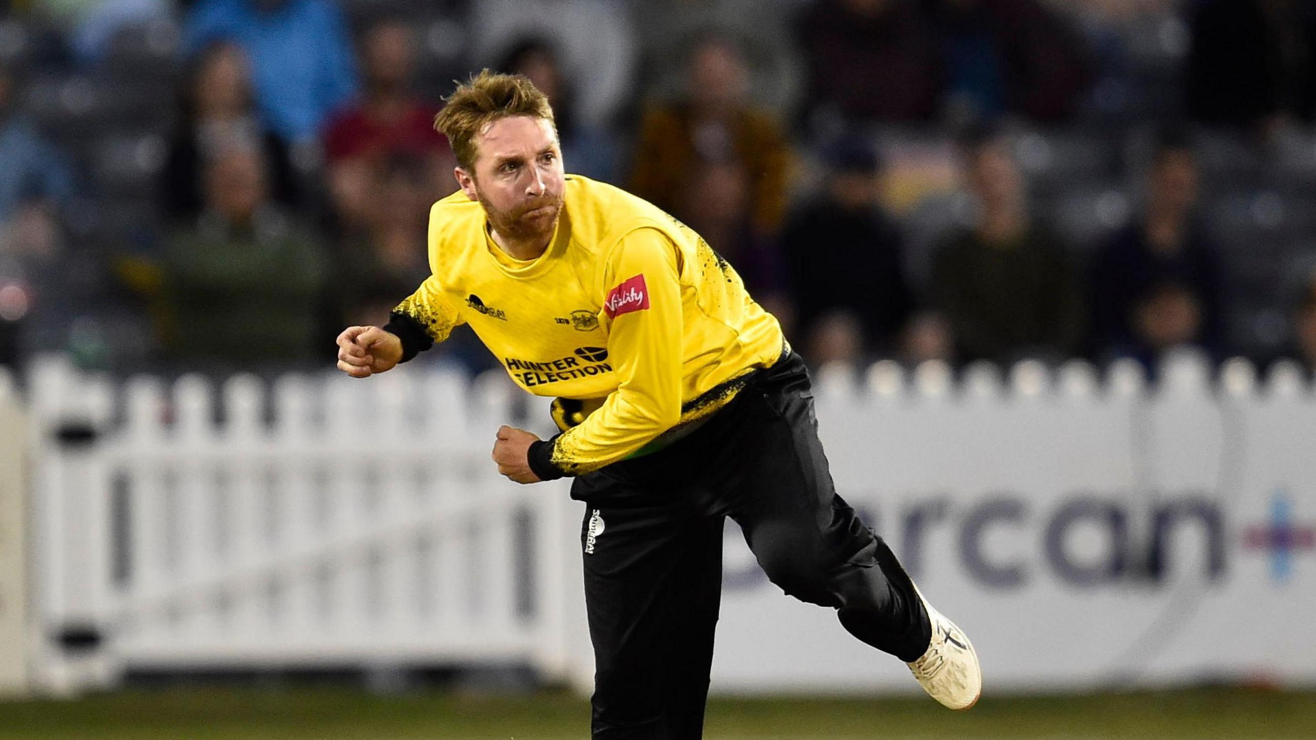 Tom Smith bowls for Gloucestershire during a T20 match in 2021