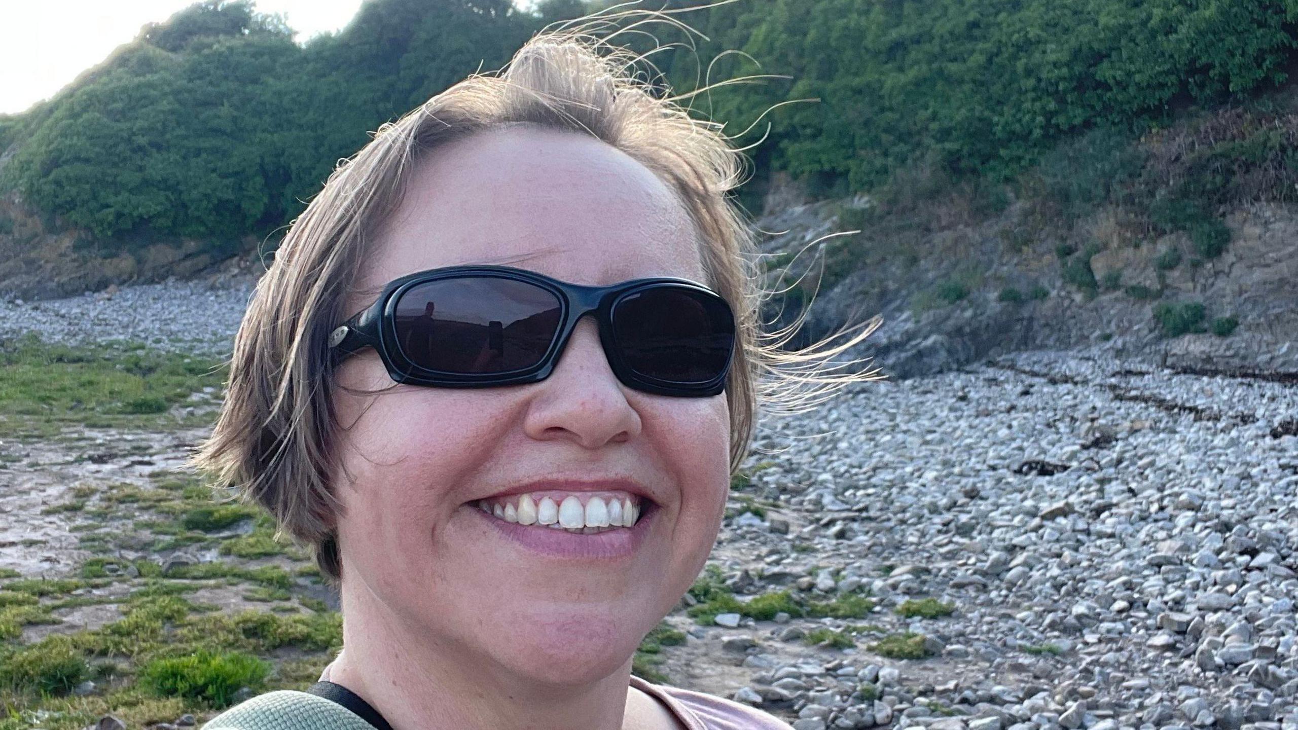 A selfie image of Terri Westgate. She is wearing dark glasses and is standing outdoors.