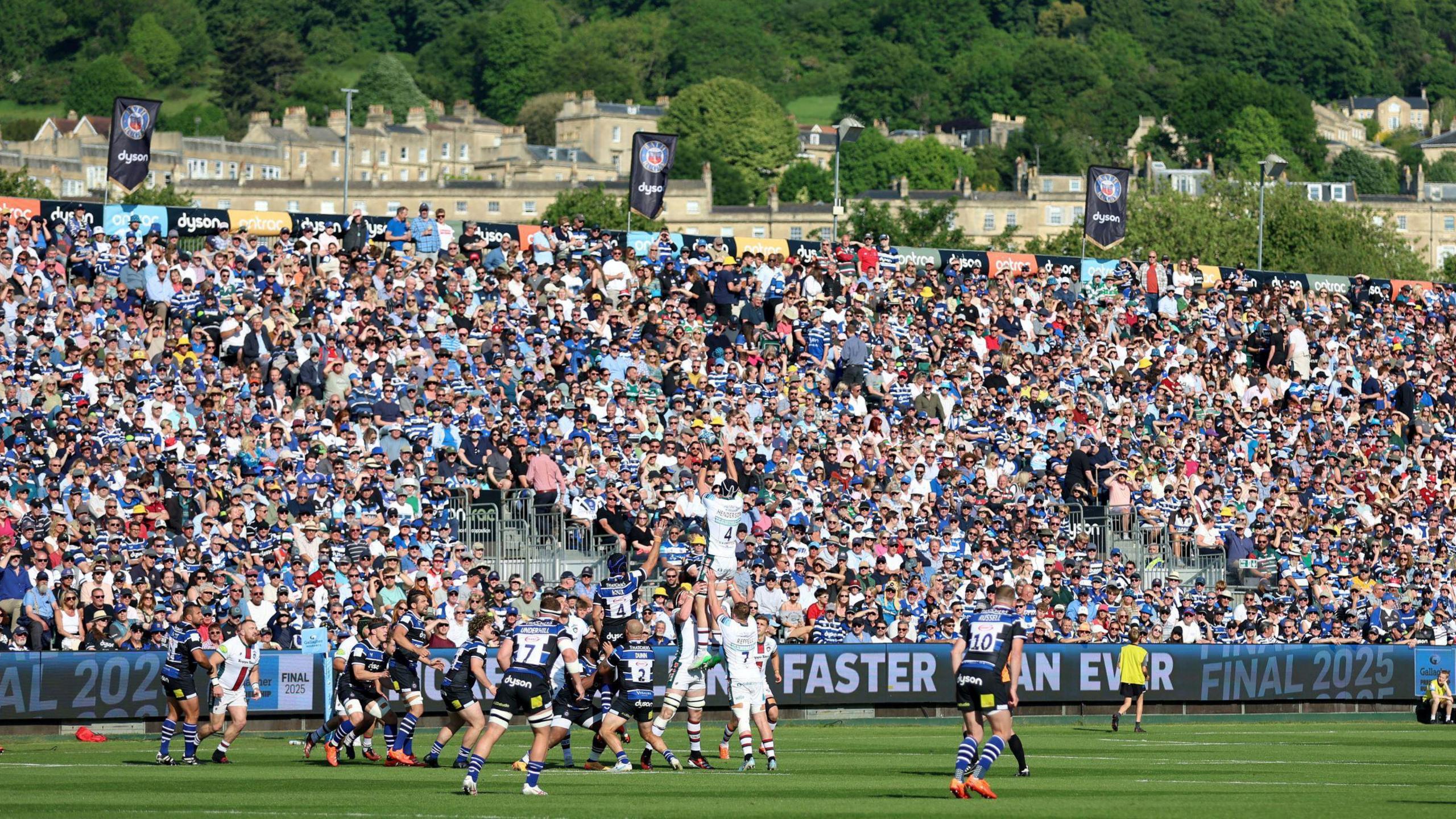Bath and Leicester players contest a lineout during the Premiership match at The Rec. In the background a large stand can be seen full of spectators
