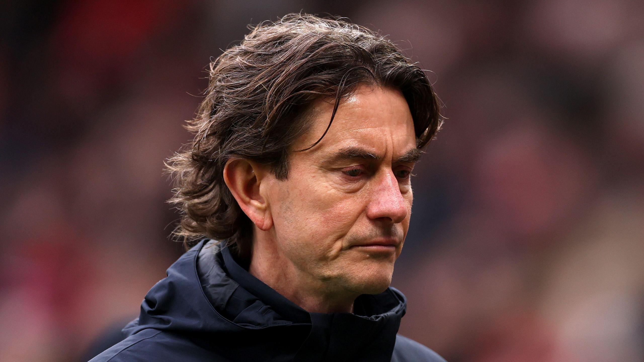 Tottenham boss Thomas Frank looks dejected after defeat by Manchester United