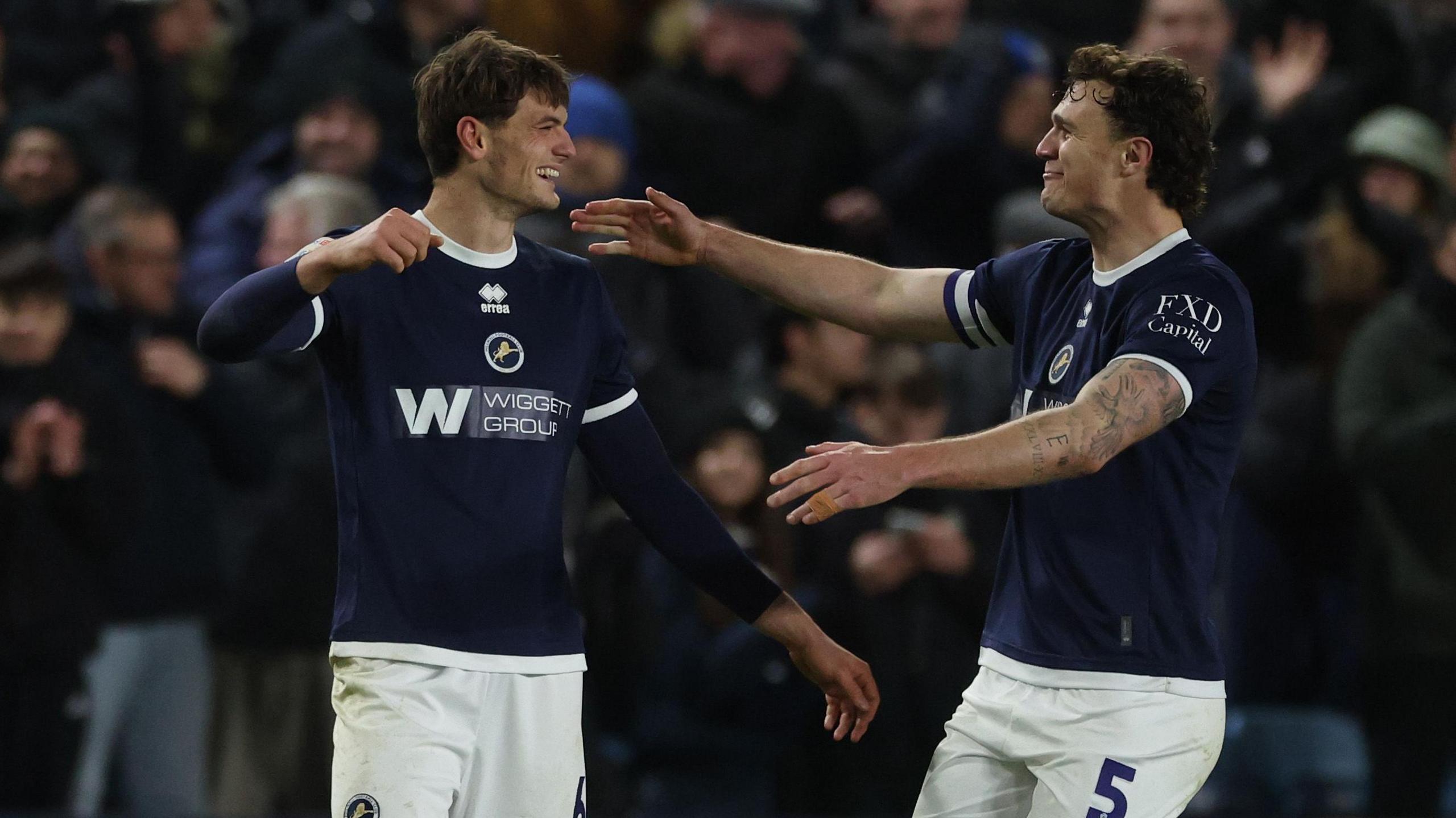Caleb Taylor celebrates with Jake Cooper 