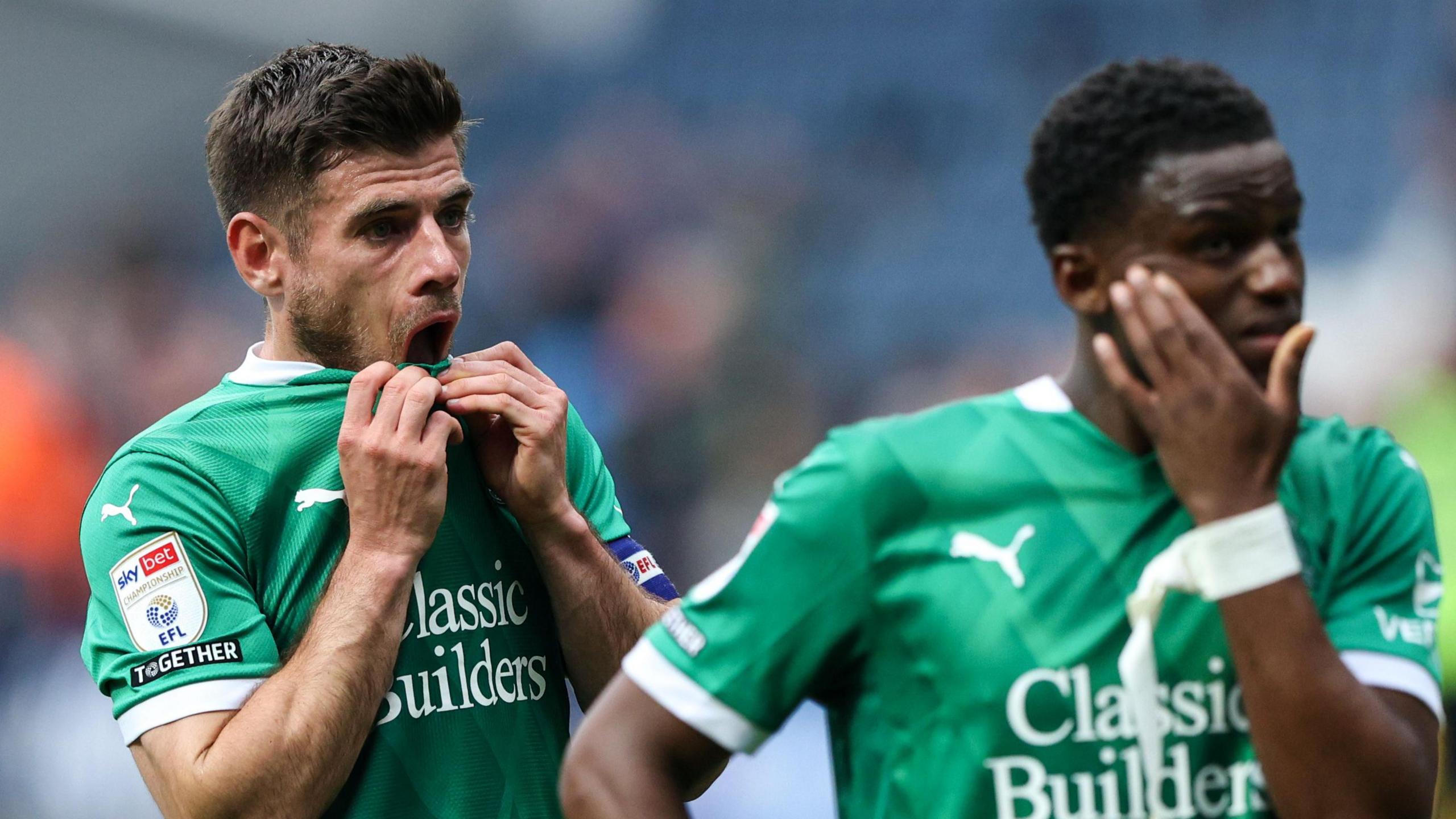 Plymouth Argyle captain Joe Edwards looks dejected