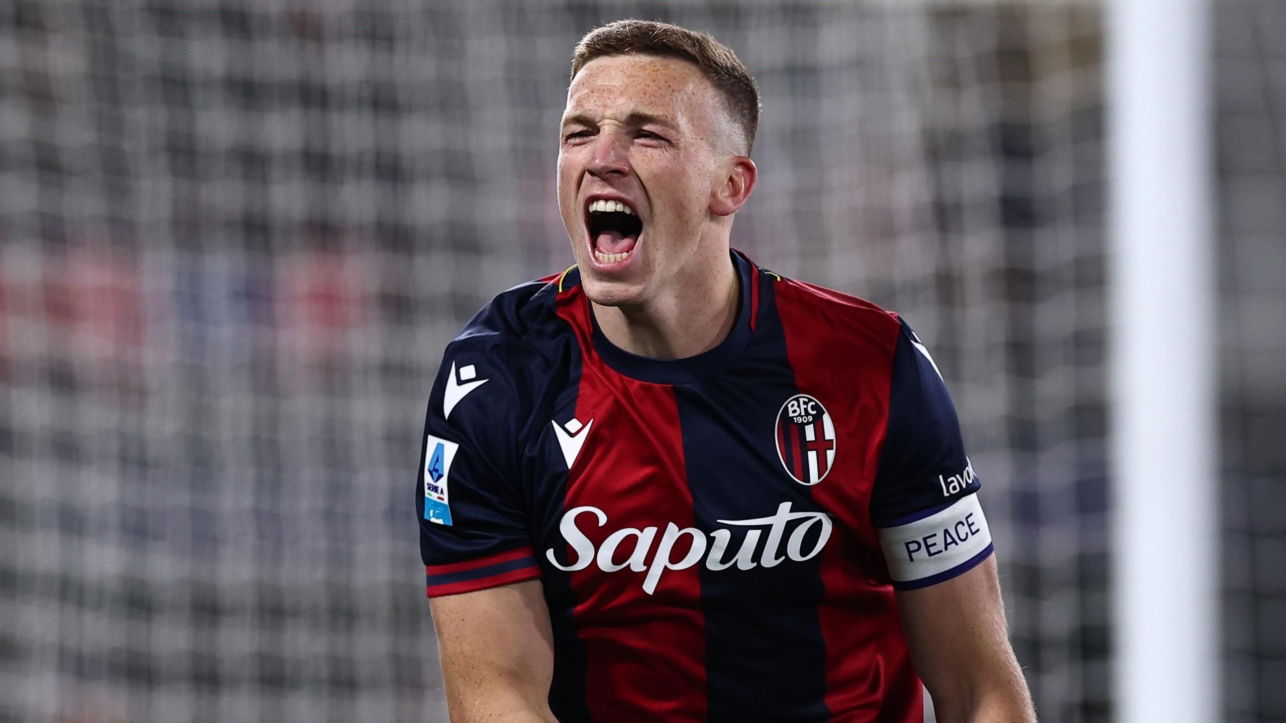 Lewis Ferguson celebrates scoring for Bologna against Roma in a Serie A match on 12 January 2025