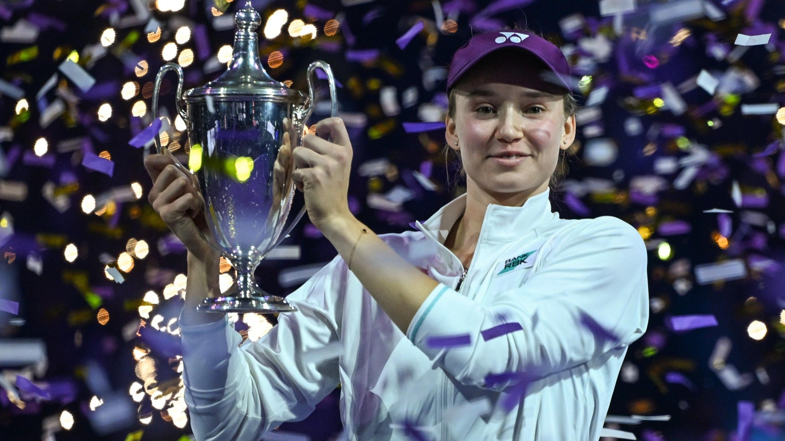 Elena Rybakina with the WTA Finals trophy