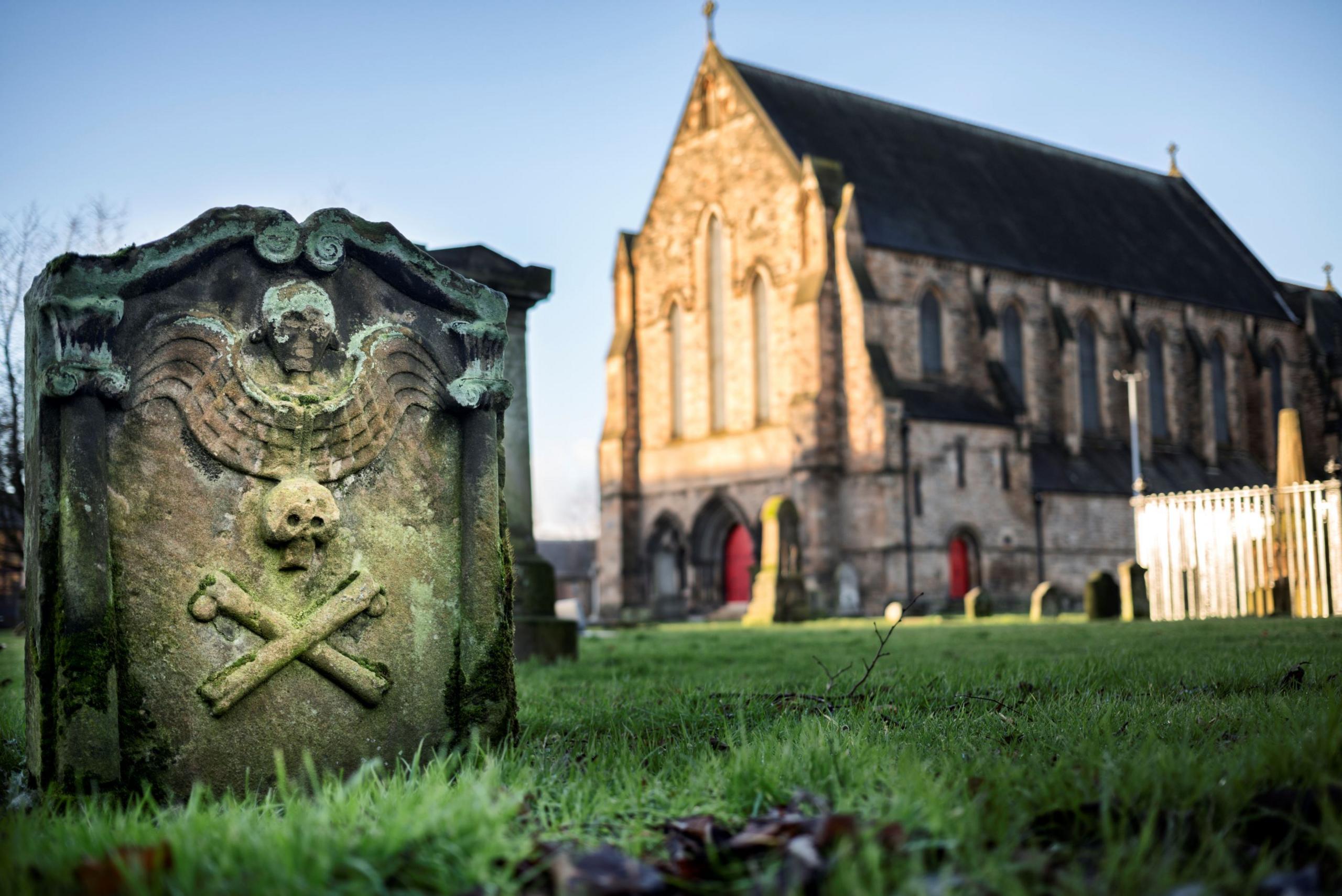 Govan Old church in the background with one of the "Govan Stones" in the foreground