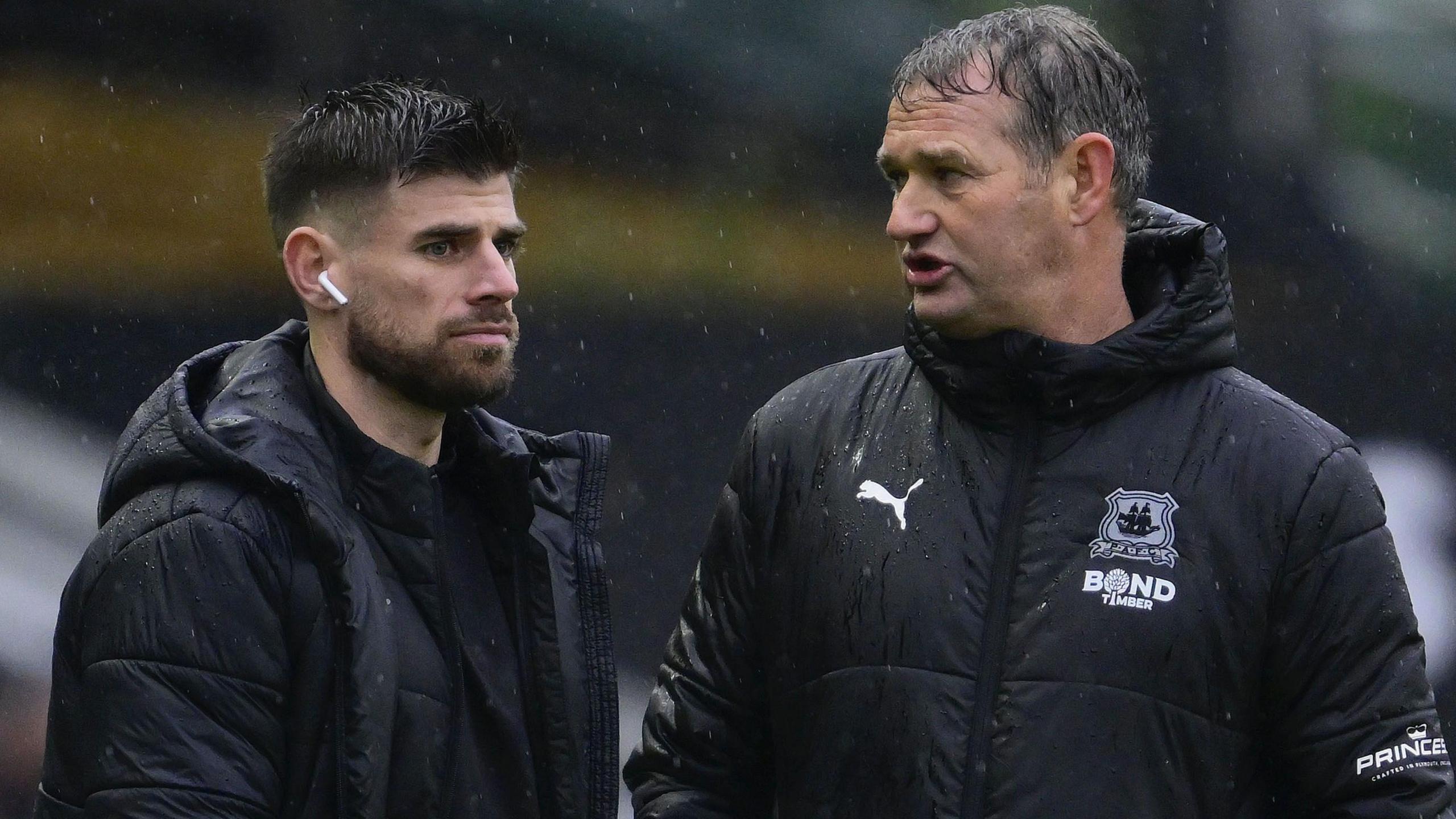 Joe Edwards (left) and Kevin Nancekivell, pictured in Plymouth club jackets before a match