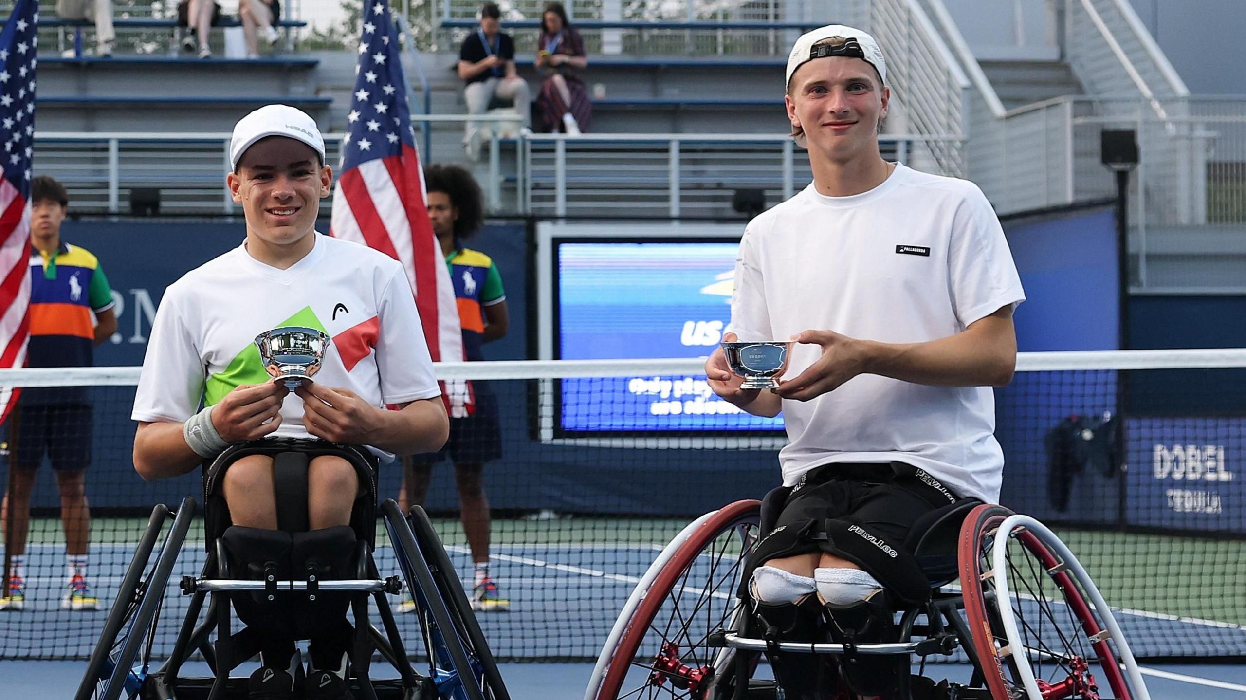 Ruben Harris (right) with doubles partner Maximilian Taucher holding their trophies after winning the US Open Junior Wheelchair Doubles title