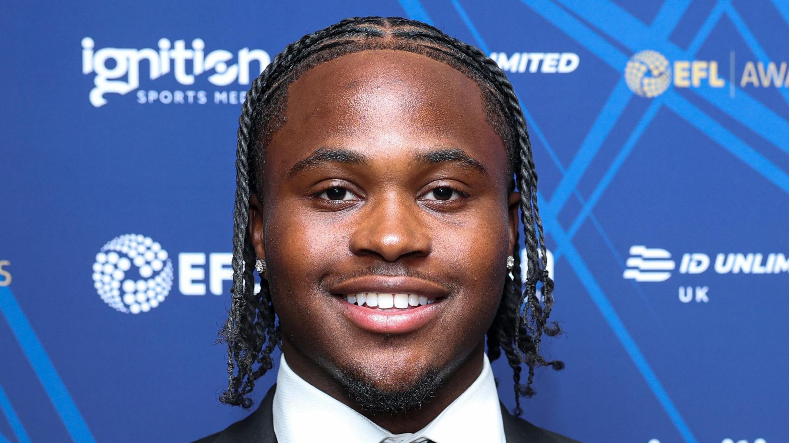 Sheldon Kendall, of Millwall, smiling while wearing a suit before an awards dinner
