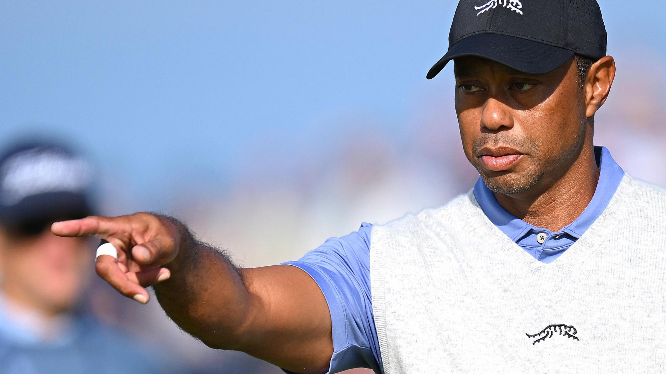 Tiger Woods pointing during a practice round at Royal Troon