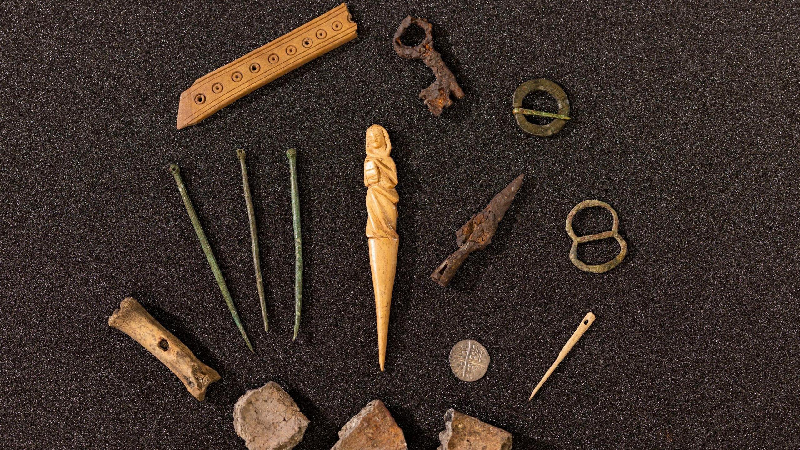 A collection of medieval items excavated from the castle, including the hairpin, brooch pins and bits of bone