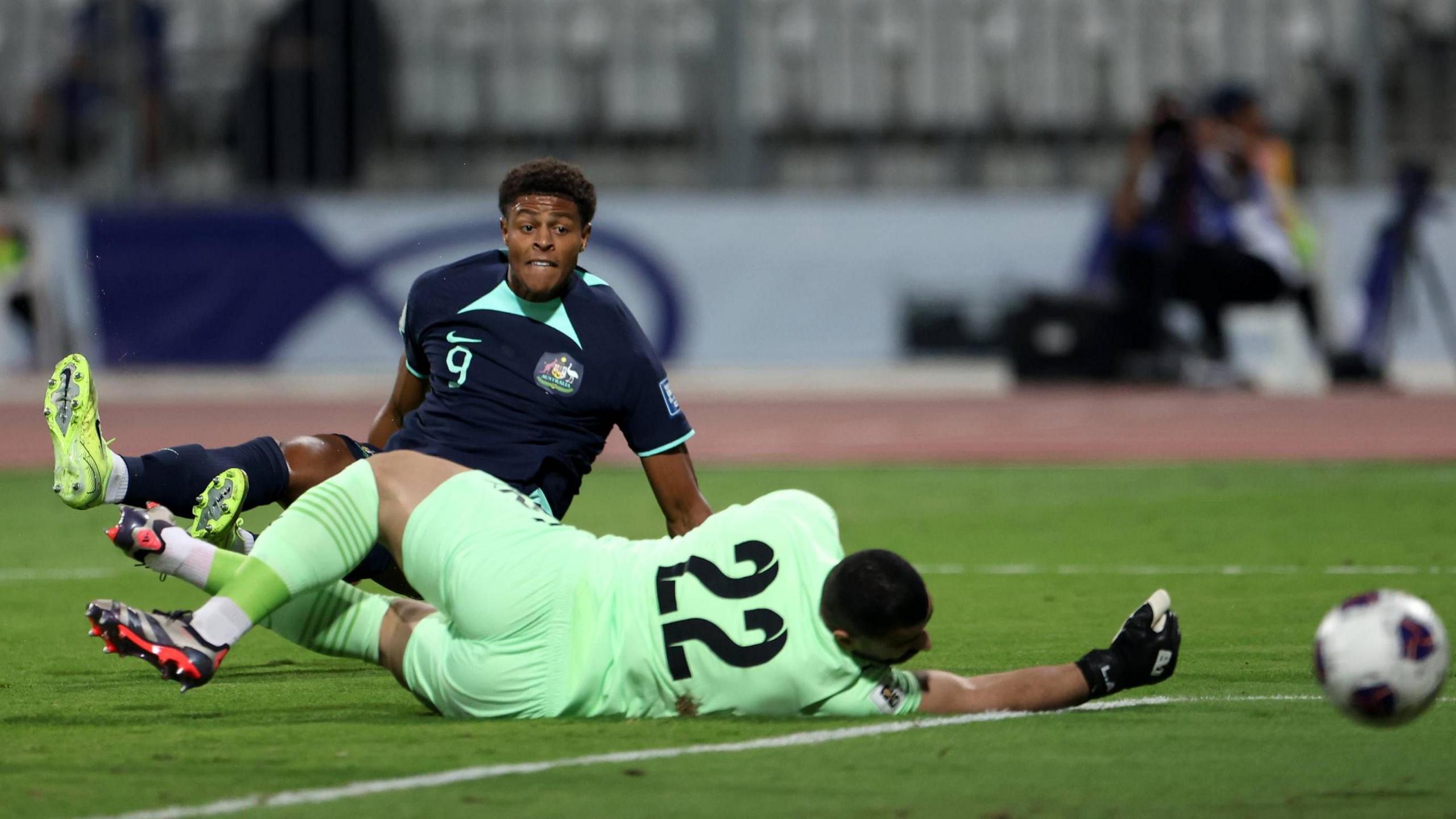 Portsmouth footballer Kusini Yengi playing for Australia against Bahrain