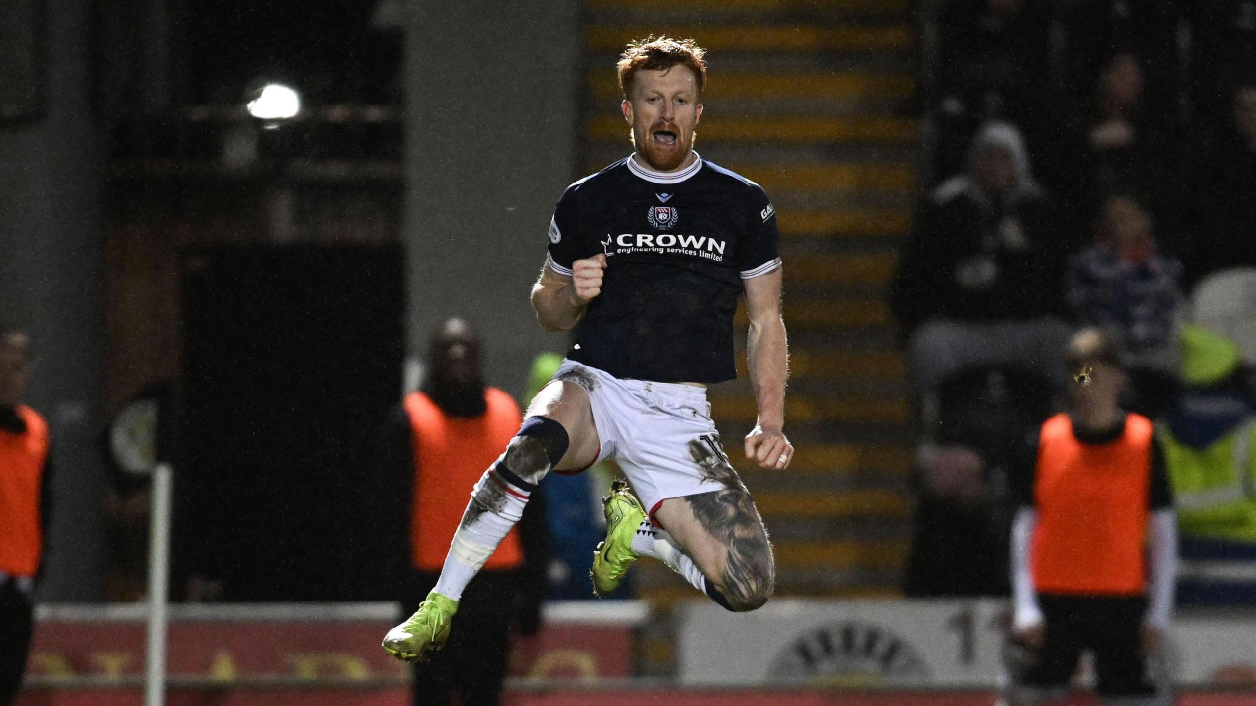 Simon Murray celebrates scoring his second goal in Dundee's 2-1 win over St Mirren in Paisley