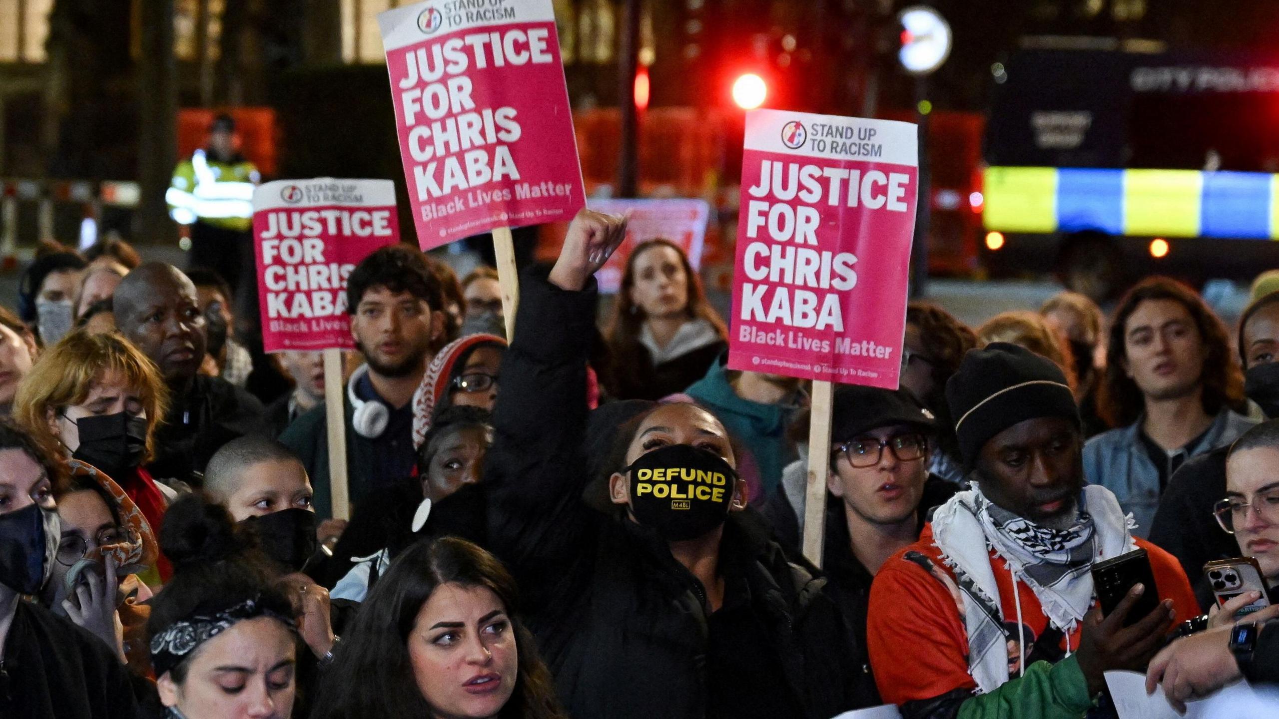 People holding placards outside the court suggesting justice had not been done 