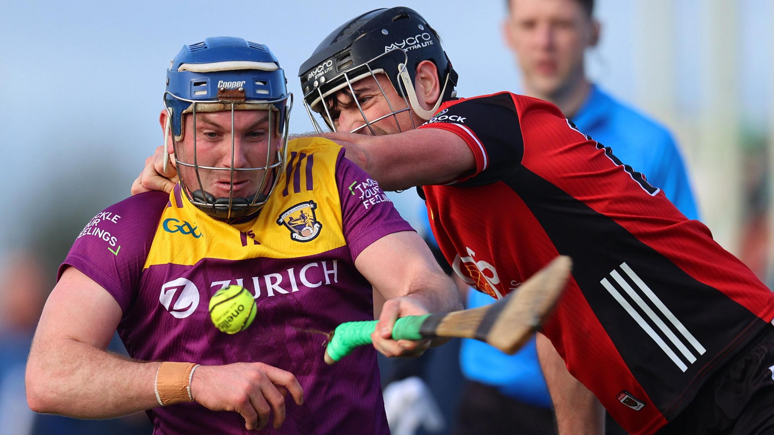 Niall McFarland challenges Wexford's Kevin Foley