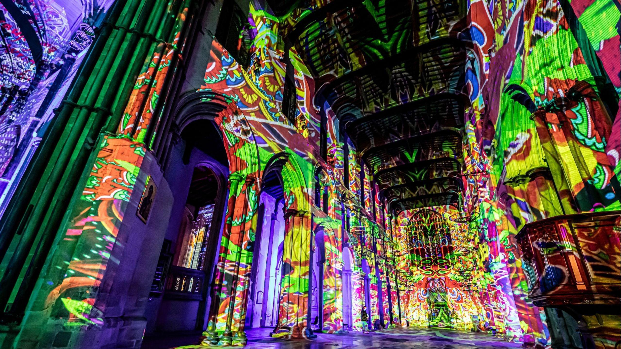 The inside of a church will lit with vibrant multi-coloured lighting.