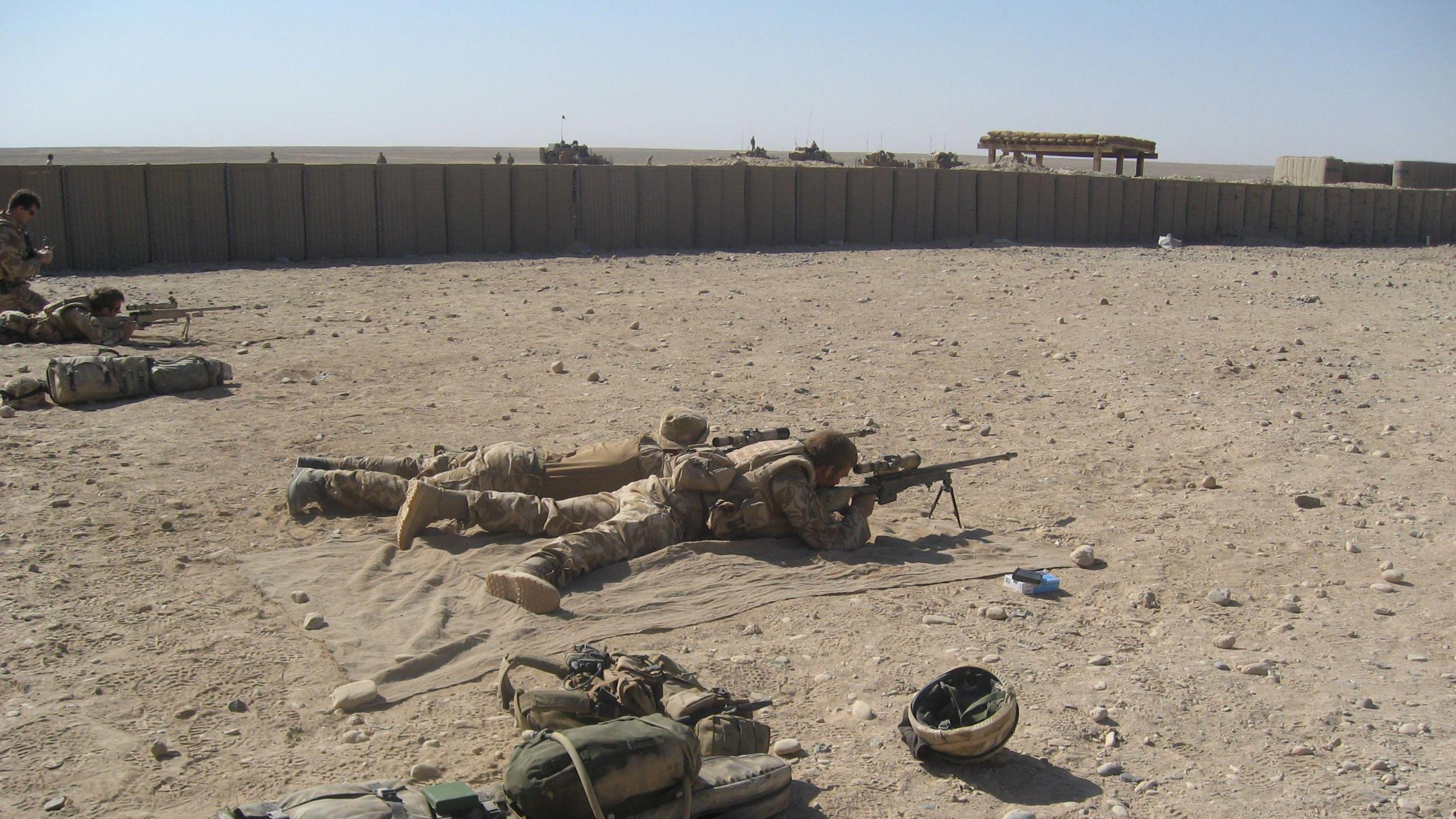 Barney Barnett testing sniper rifle on range