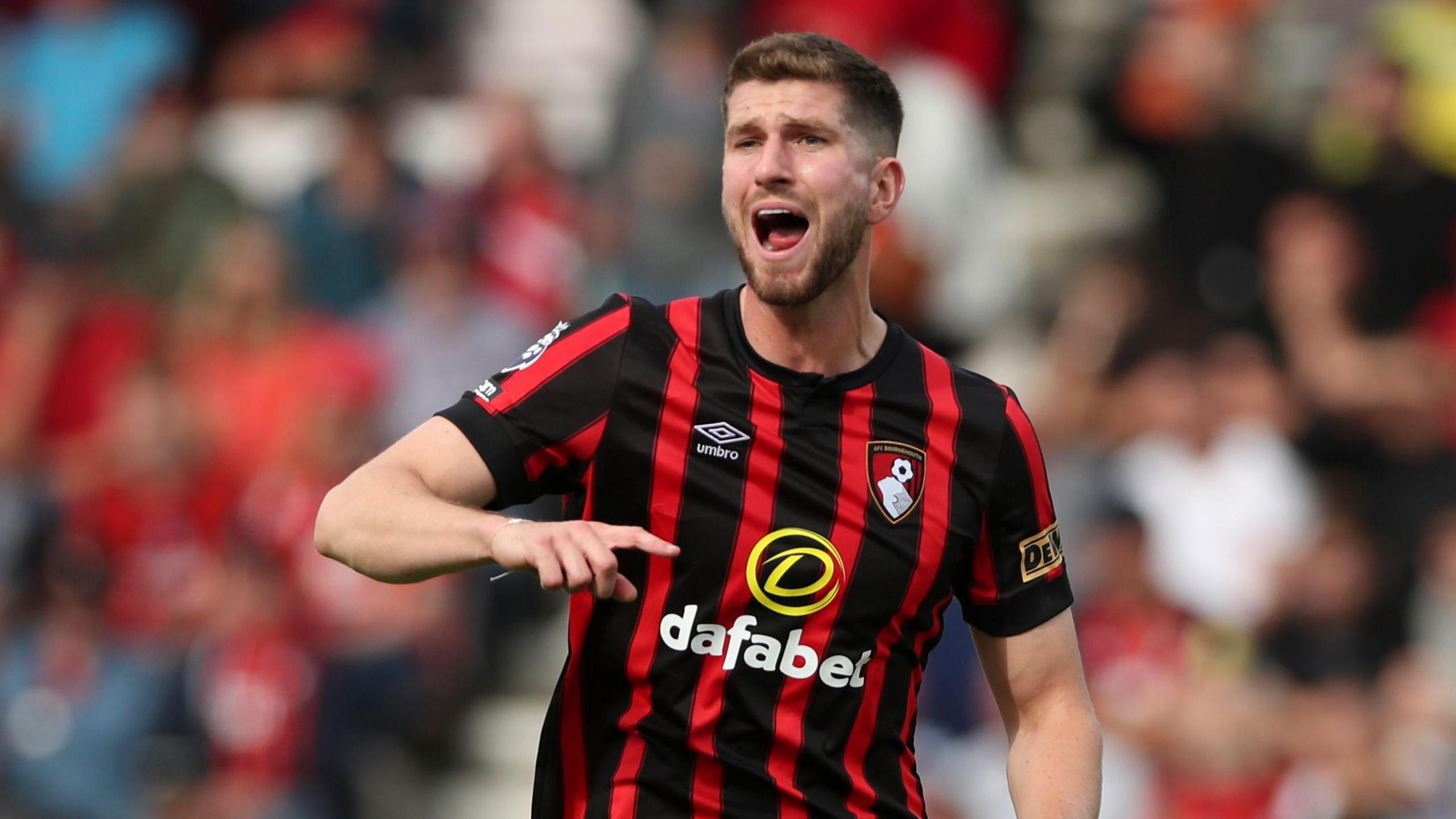 Chris Mepham shouts and gesticulates during a match for Bournemouth