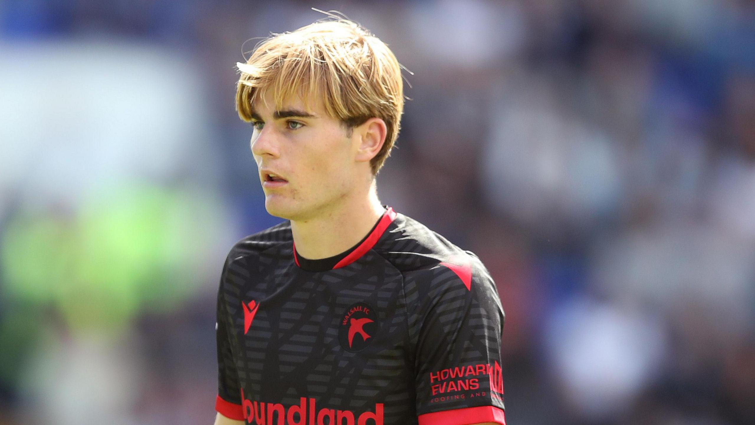 Nathan Lowe standing on the field during a game for Walsall