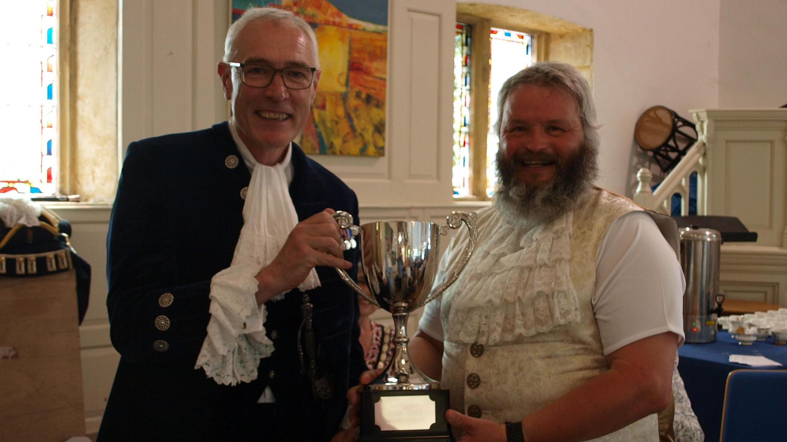 Stuart Cumming collecting his trophy