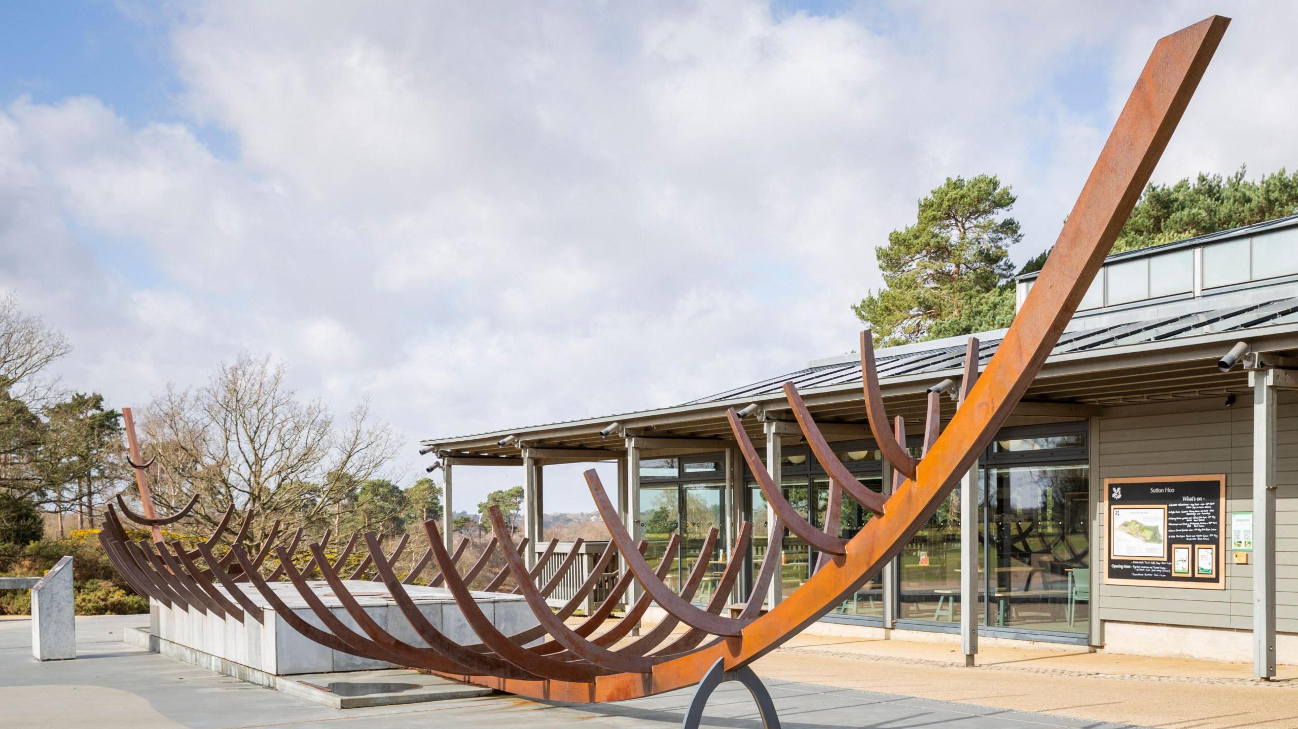 The sculpture of the Great Ship Burial in the courtyard at Sutton Hoo