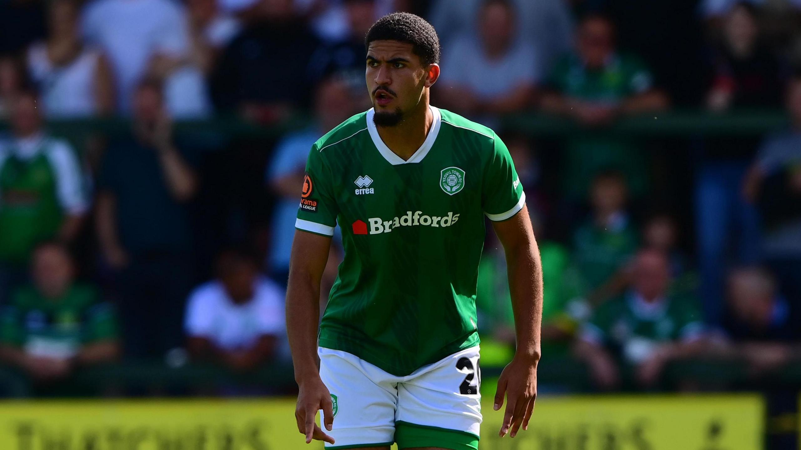 Raphael Araoye standing on the pitch during a game for Yeovil
