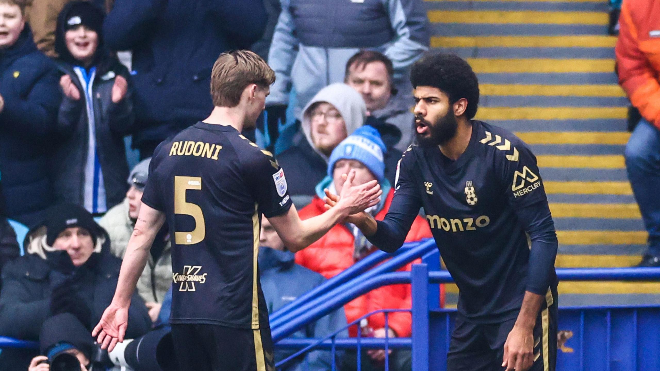 Coventry striker Ellis Simms celebrates his opening goal with creator Jack Rudoni