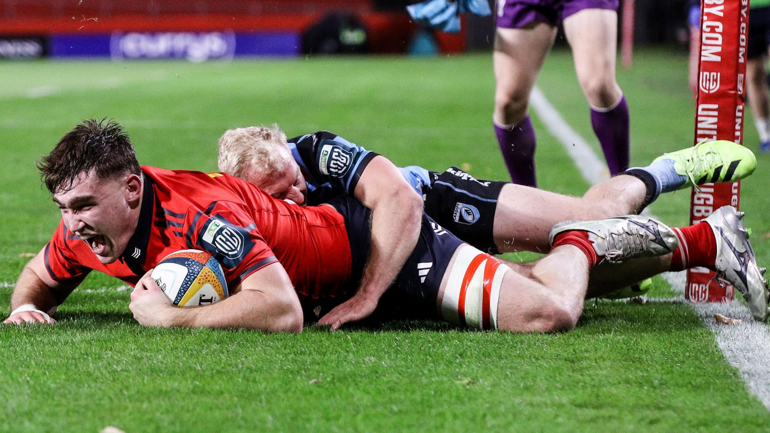 Ruadhan Quinn celebrates scoring a try